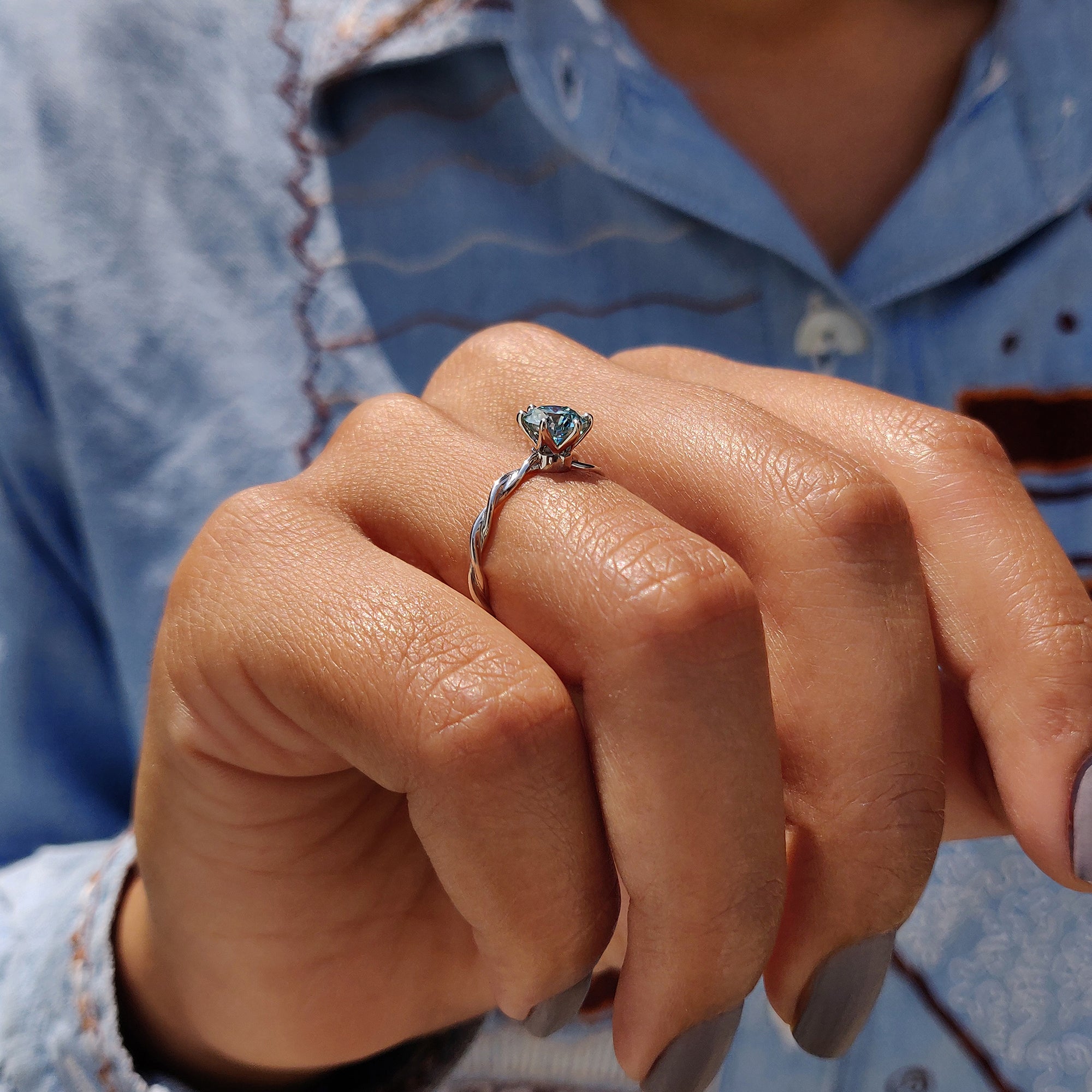 Round Solitaire Engagement Ring With Twisted Setting