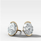 Oval Cut Half Bezel Diamond Studs