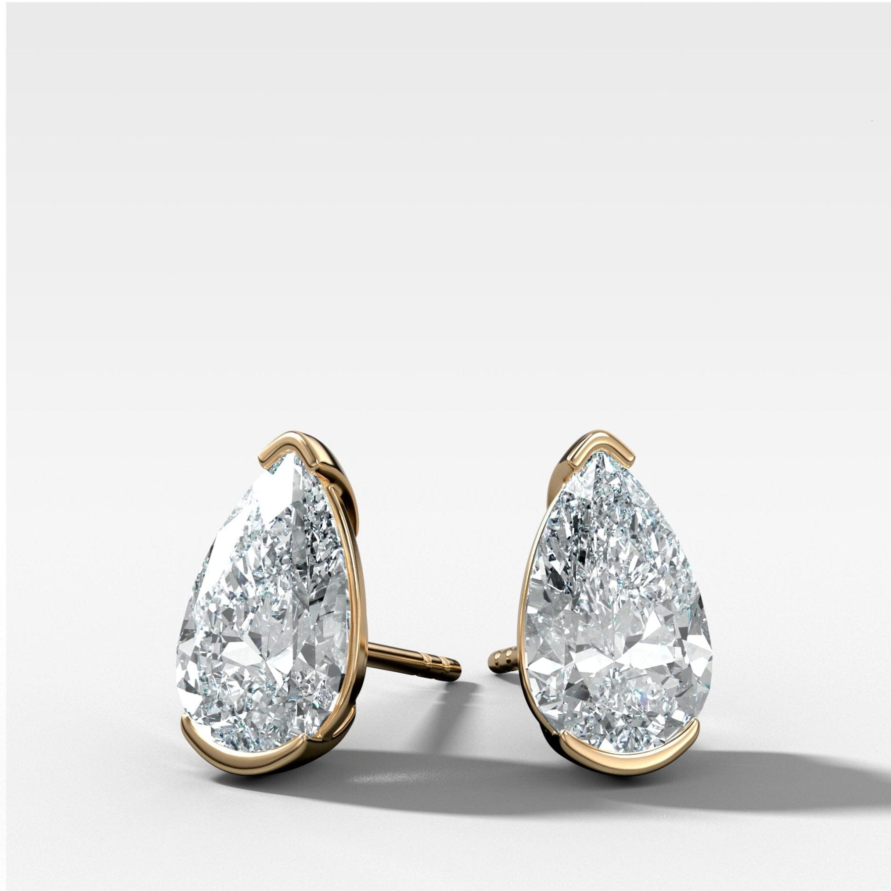 Pear Cut Half Bezel Diamond Studs