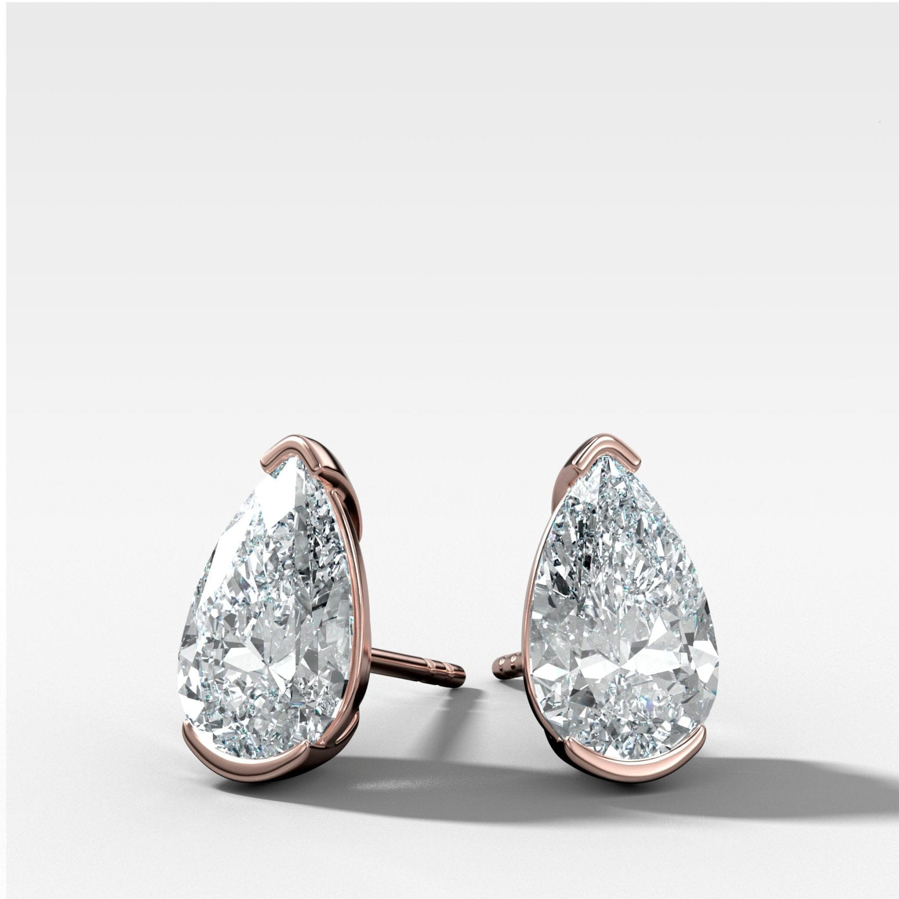 Pear Cut Half Bezel Diamond Studs