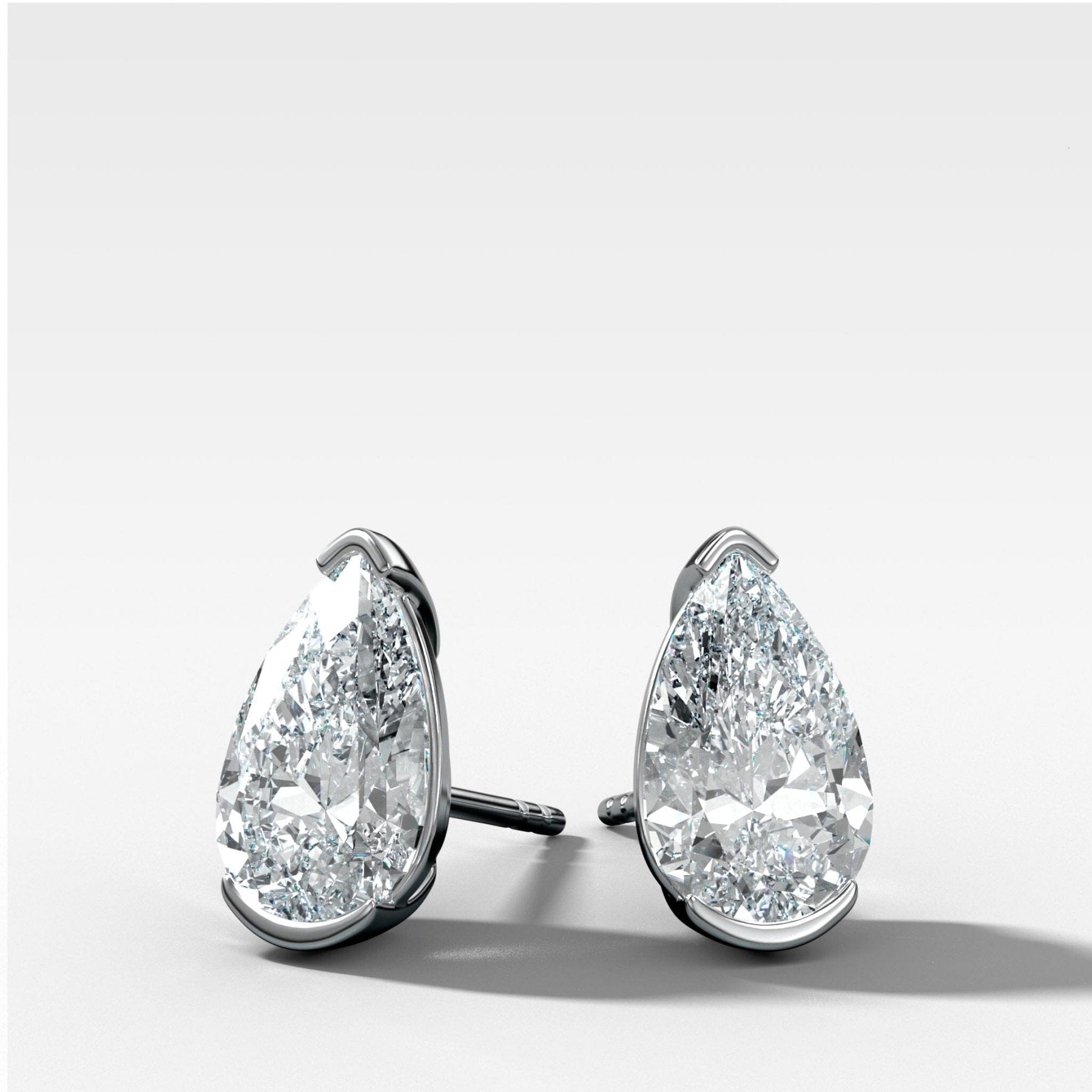 Pear Cut Half Bezel Diamond Studs