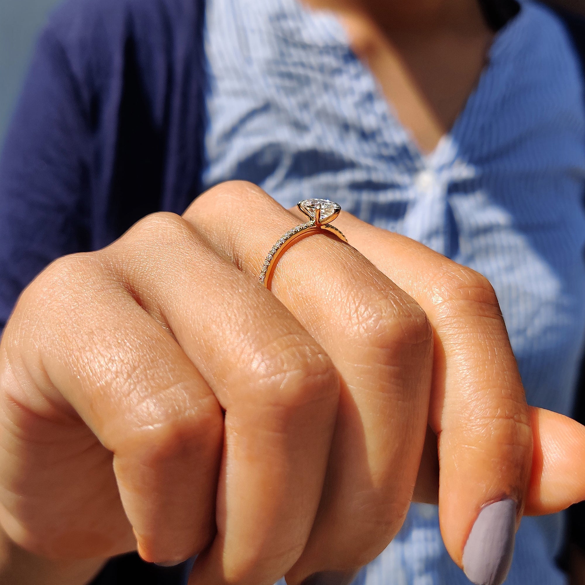 Pear Shaped Engagement Ring in Round Cut Pave Band