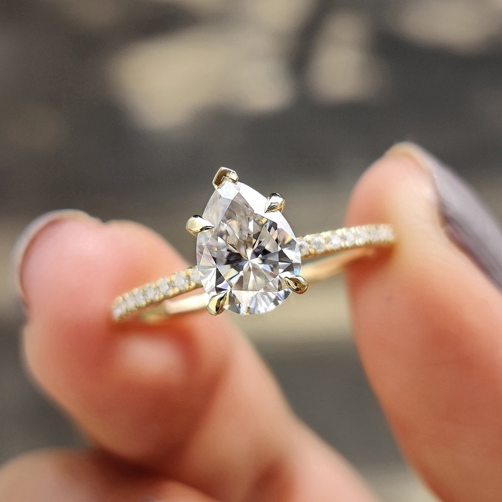 Pear Shaped Engagement Ring in Round Cut Pave Band