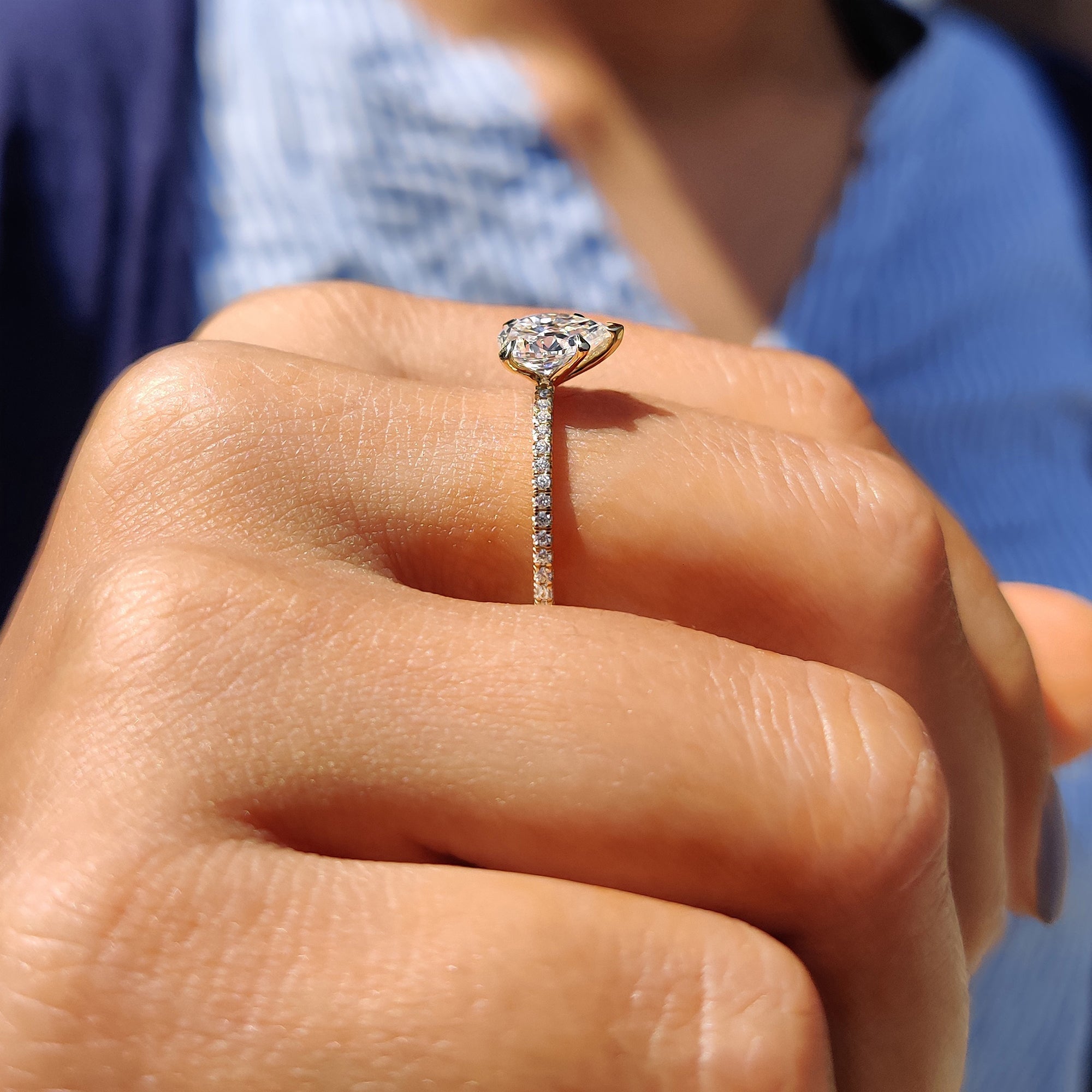 Pear Shaped Engagement Ring in Round Cut Pave Band
