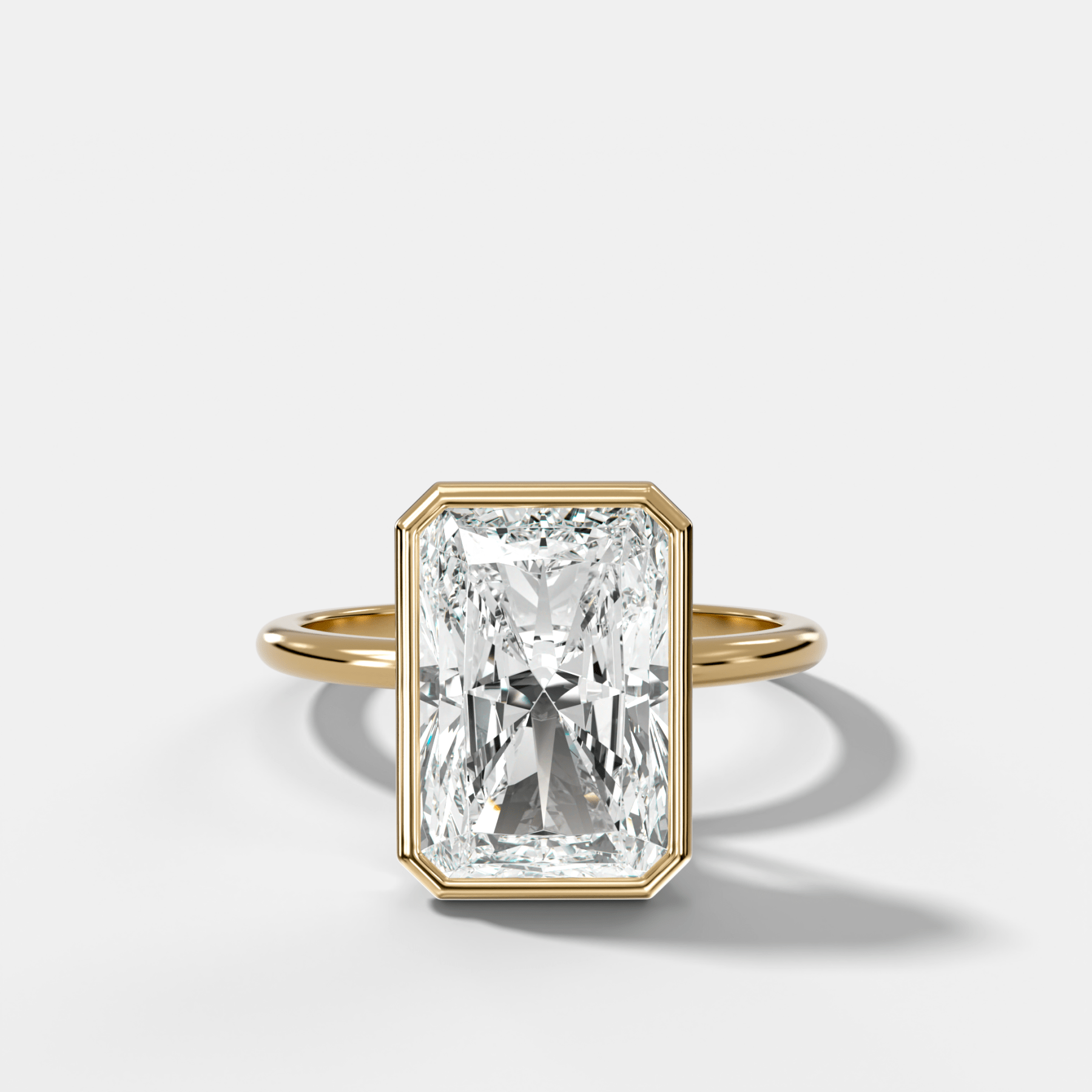 Penumbra Bezel Hidden Halo Engagement Ring with Elongated Radiant Cut