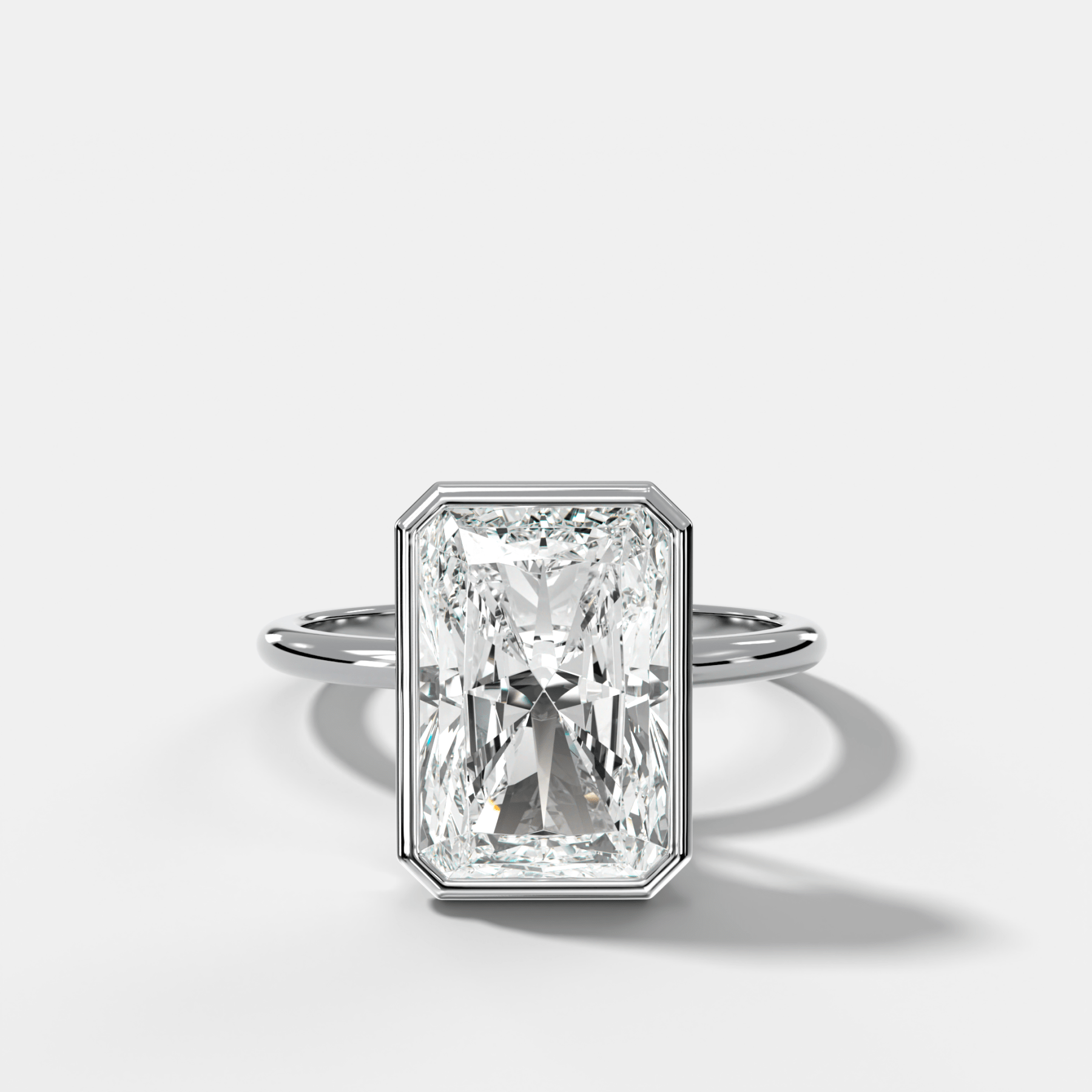 Penumbra Bezel Hidden Halo Engagement Ring with Elongated Radiant Cut