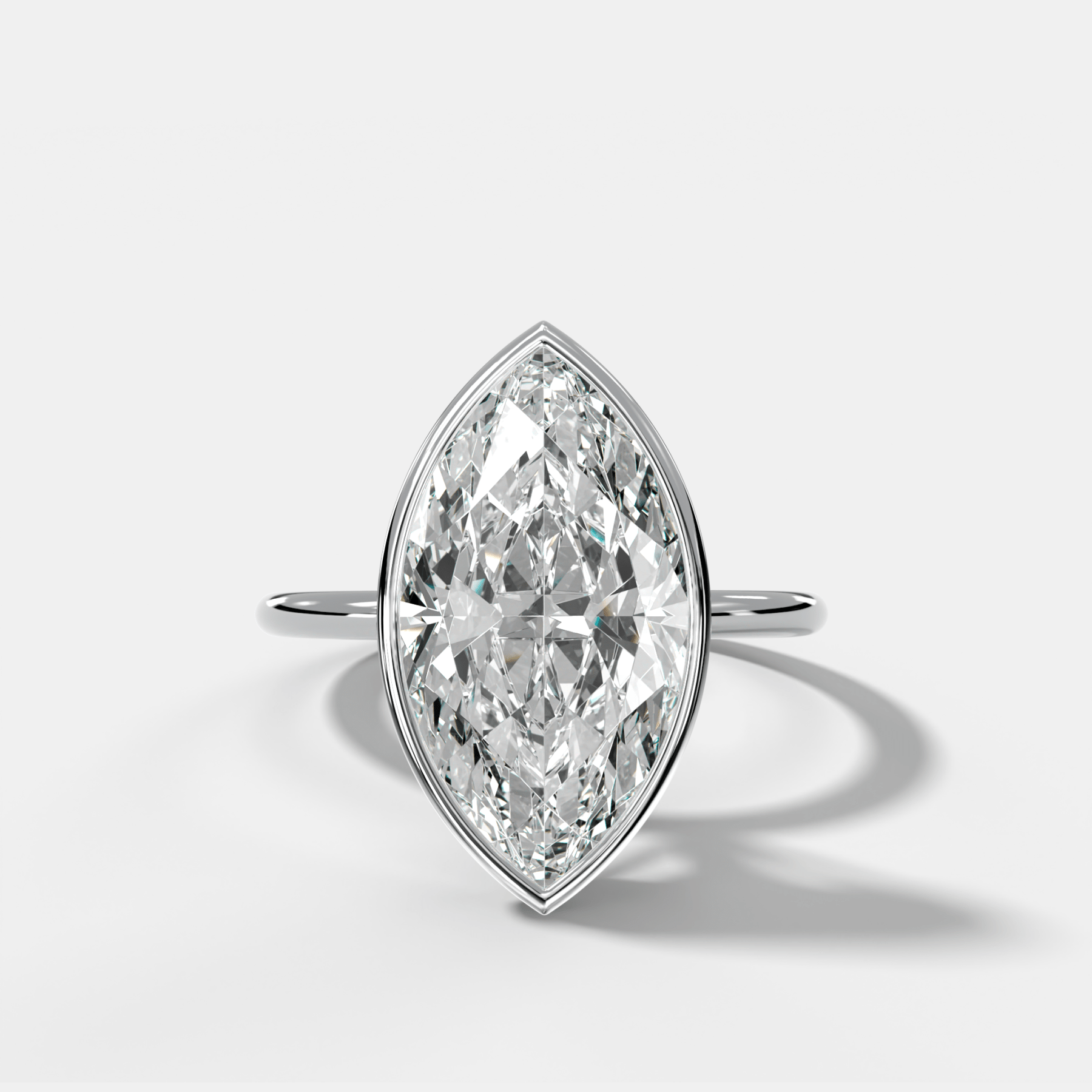 Penumbra Bezel Hidden Halo Engagement Ring with Marquise Cut