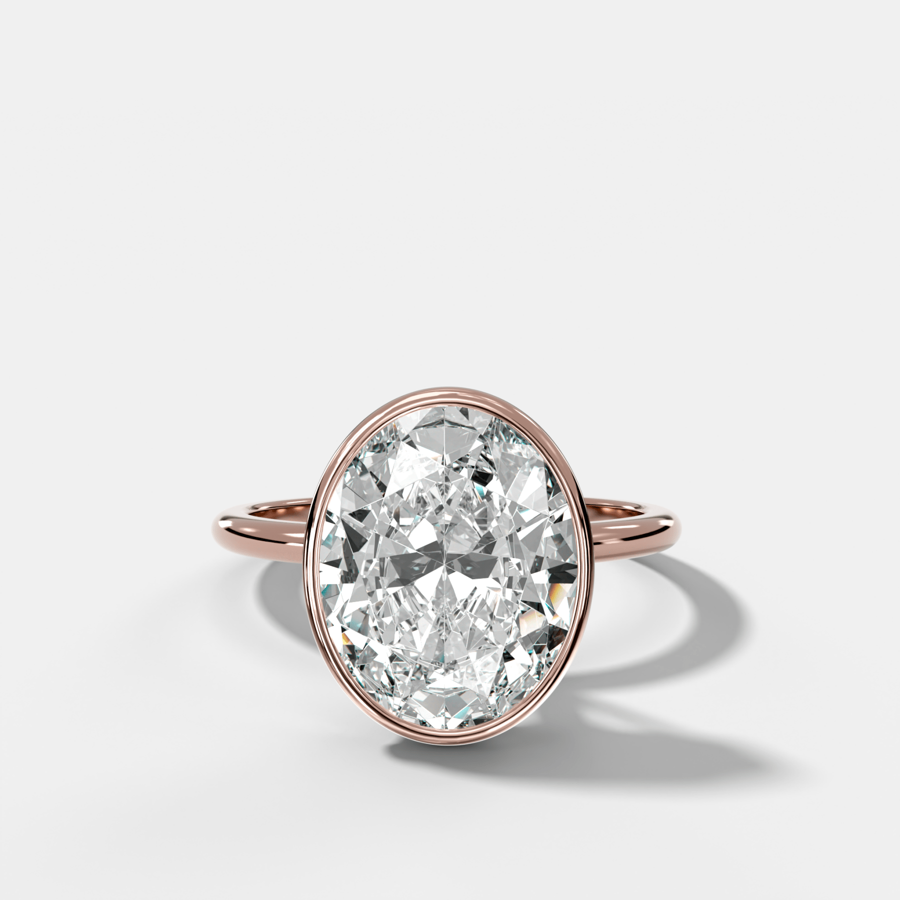 Penumbra Bezel Hidden Halo Engagement Ring with Oval Cut