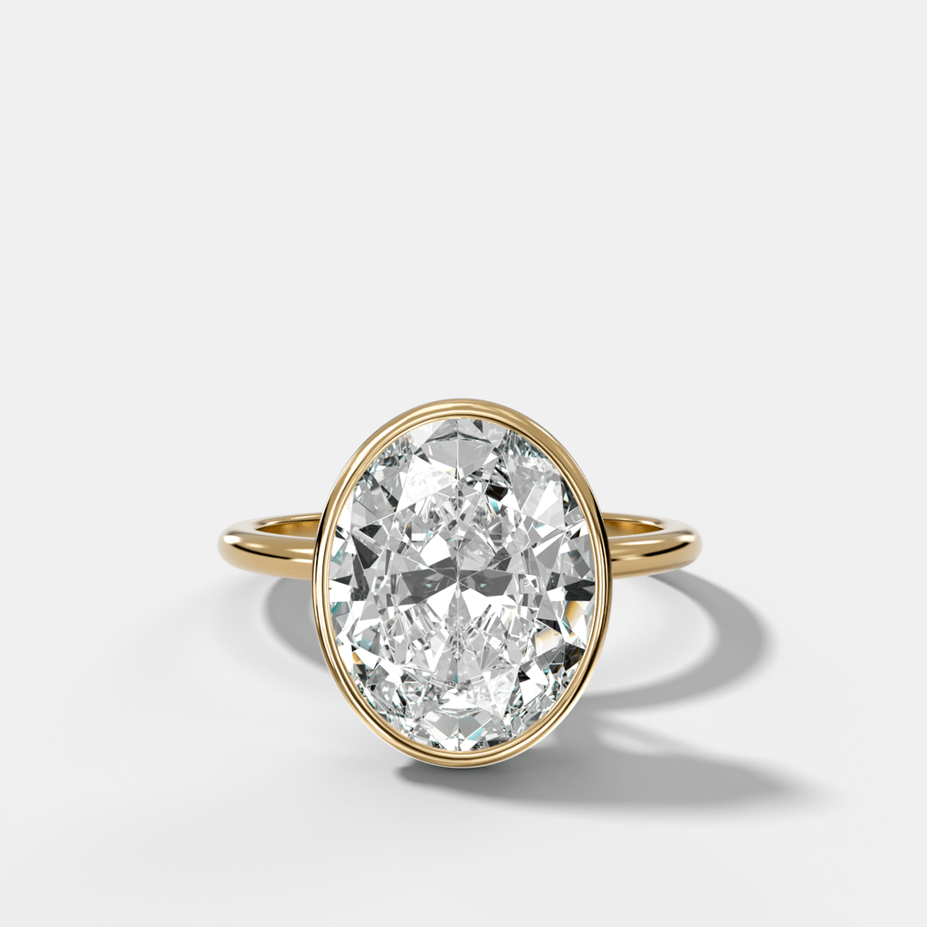 Penumbra Bezel Hidden Halo Engagement Ring with Oval Cut