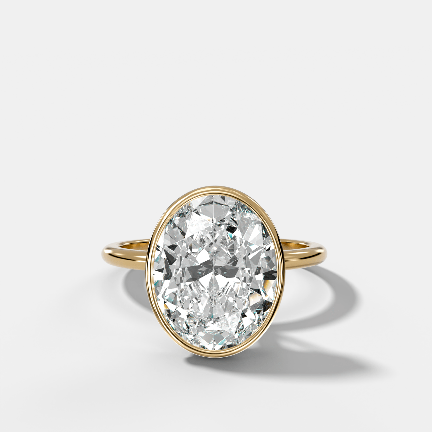Penumbra Bezel Hidden Halo Engagement Ring with Oval Cut