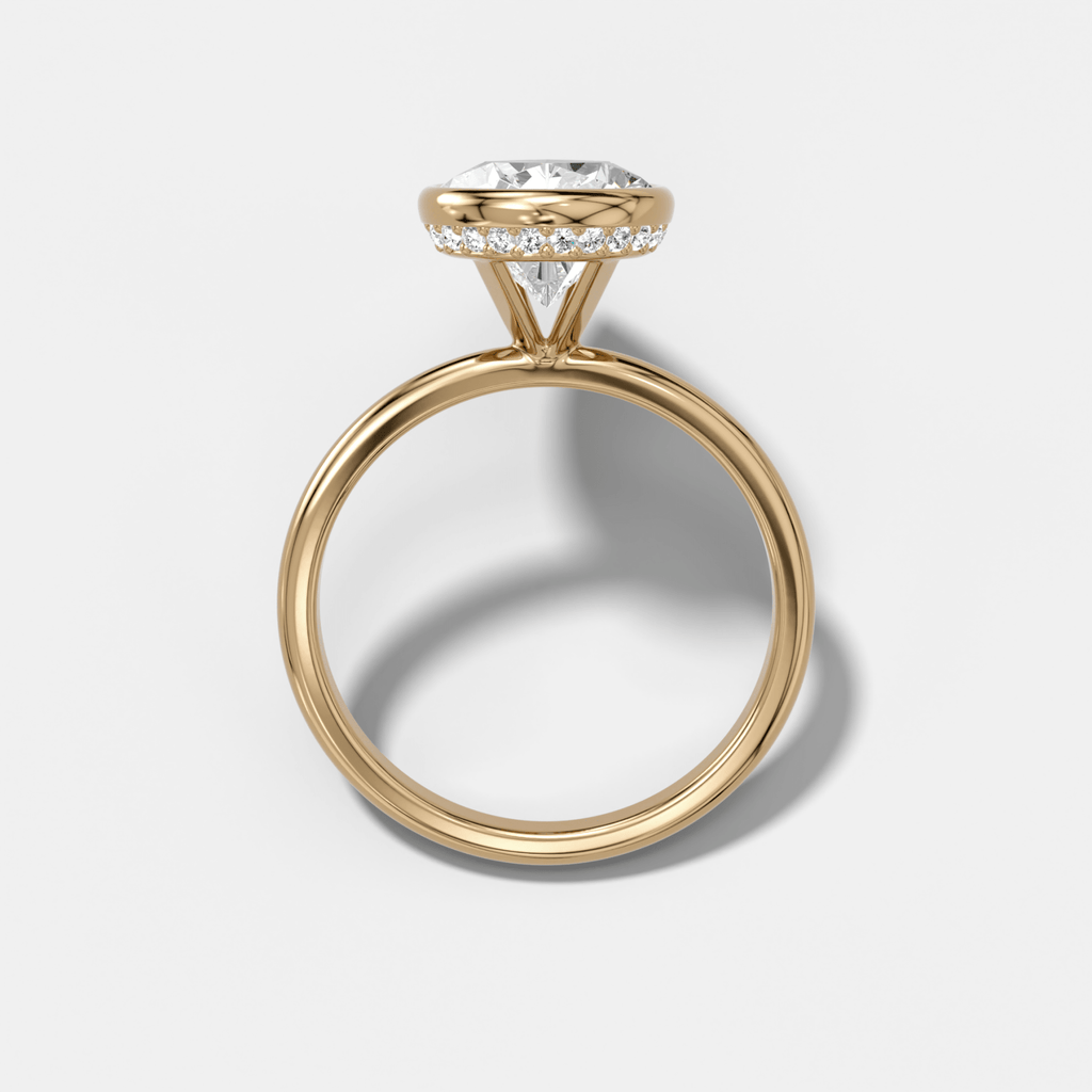 Penumbra Bezel Hidden Halo Engagement Ring with Pear Cut