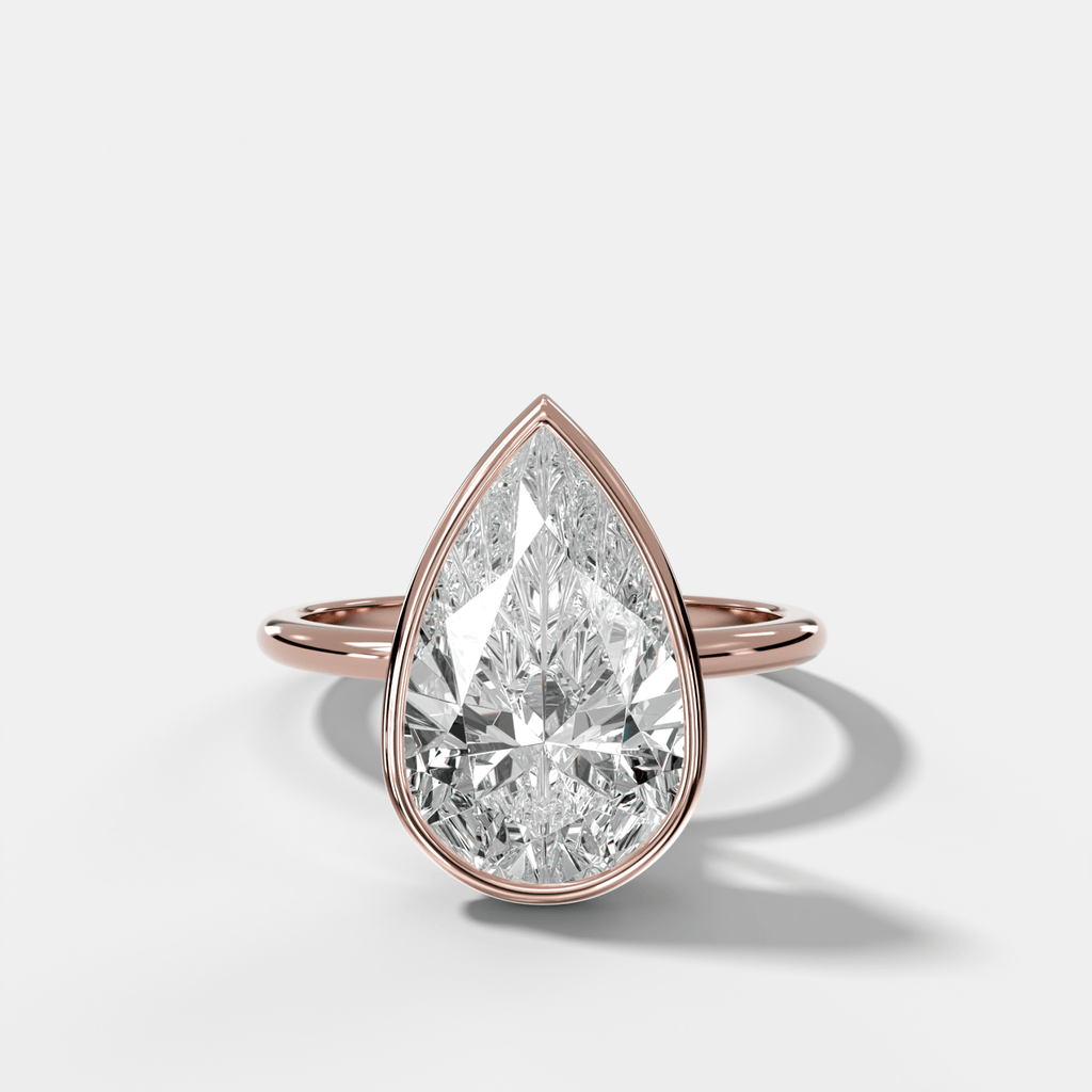Penumbra Bezel Hidden Halo Engagement Ring with Pear Cut