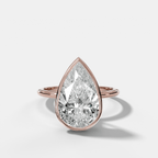 Penumbra Bezel Hidden Halo Engagement Ring with Pear Cut