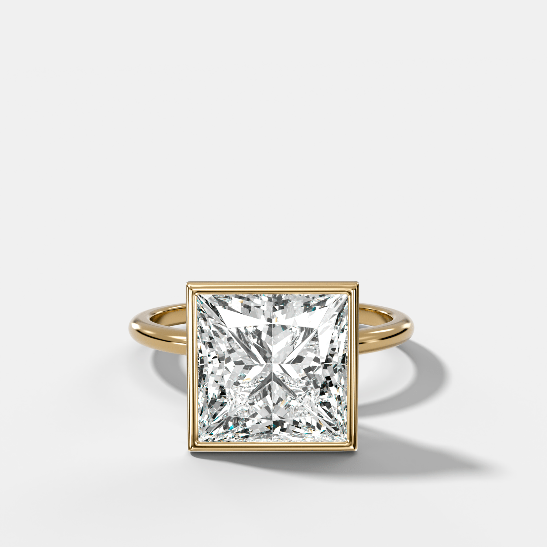 Penumbra Bezel Hidden Halo Engagement Ring with Princess Cut