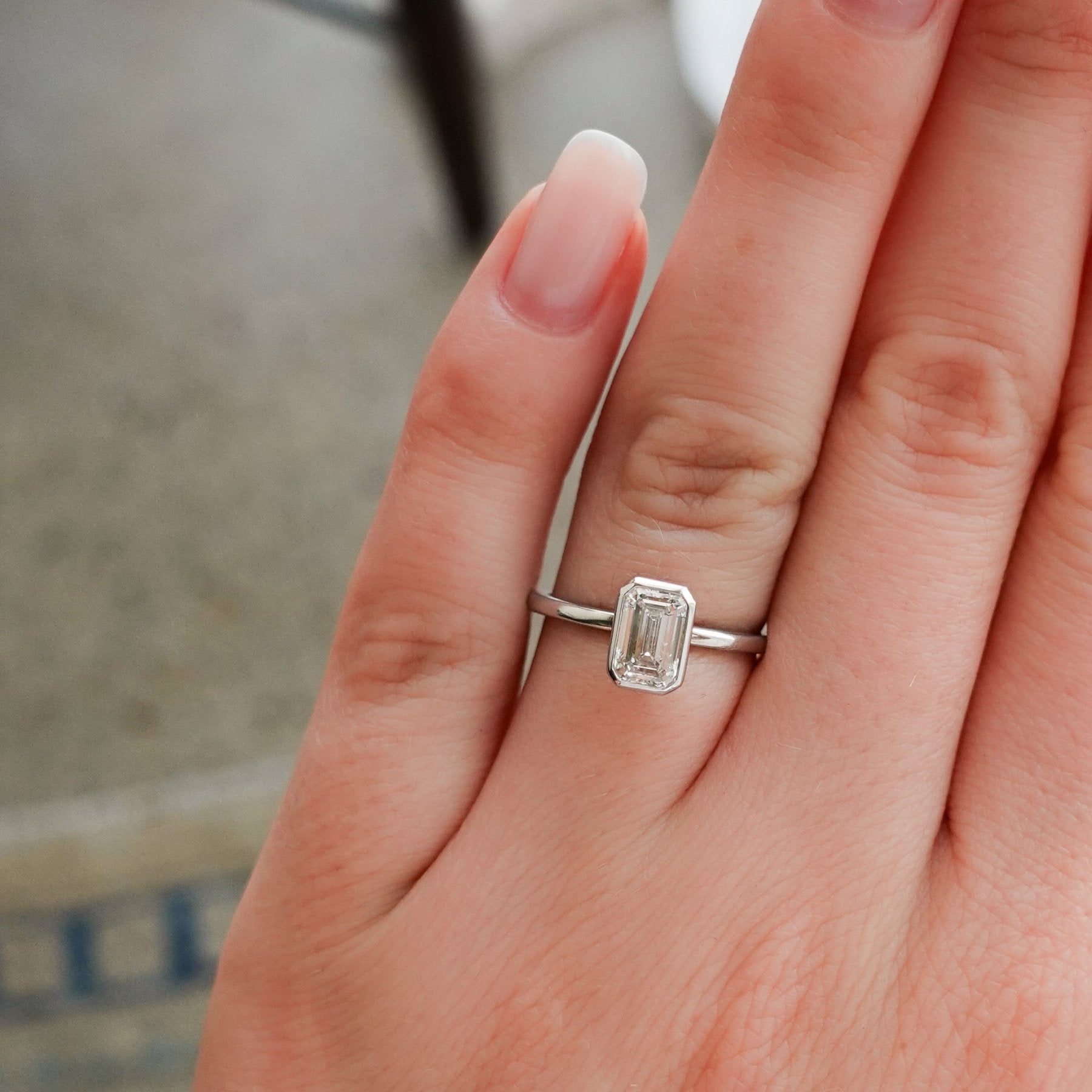 Penumbra Bezel Set Engagement Ring with 1.02ct Lab Grown Emerald Cut Diamond
