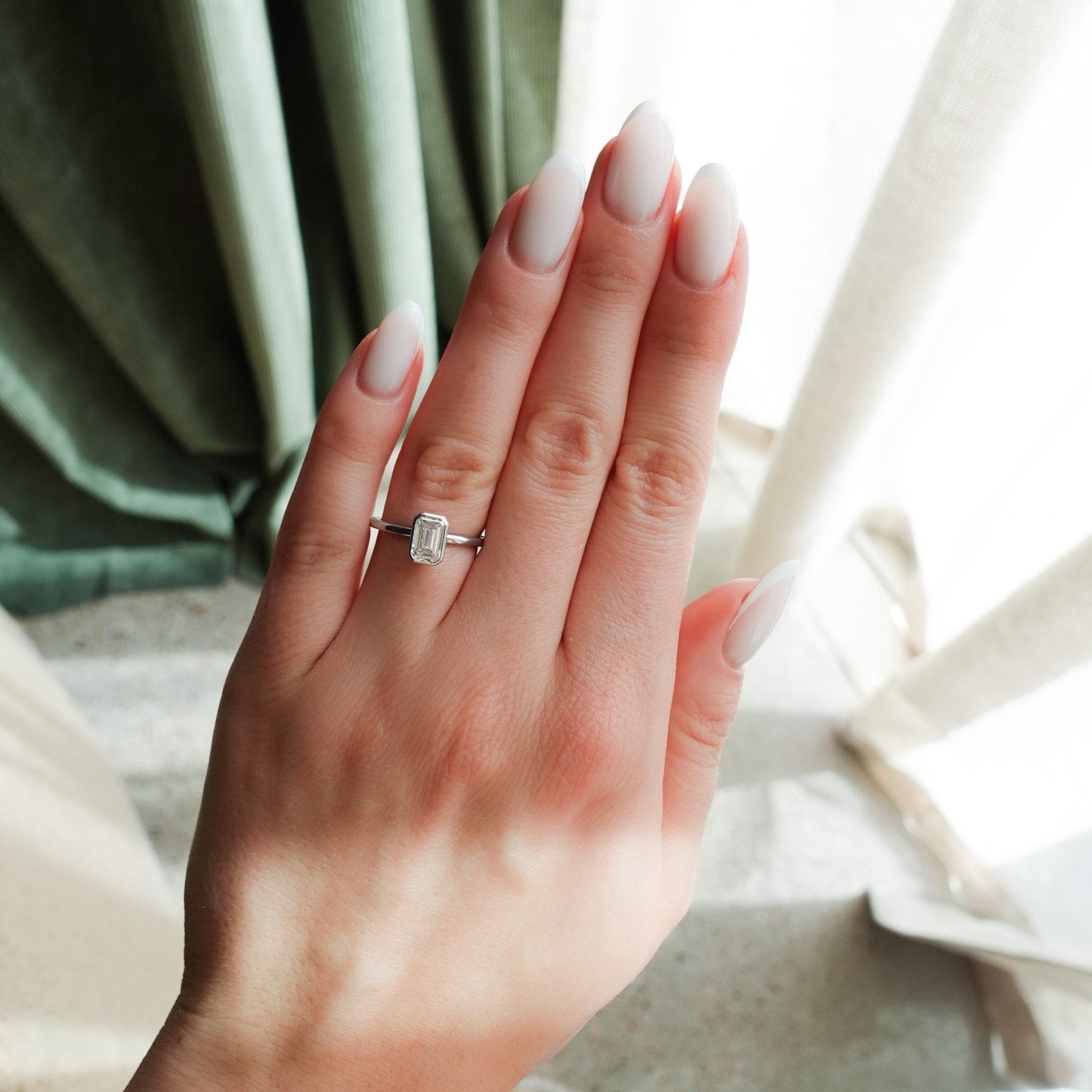Penumbra Bezel Set Engagement Ring with 1.02ct Lab Grown Emerald Cut Diamond