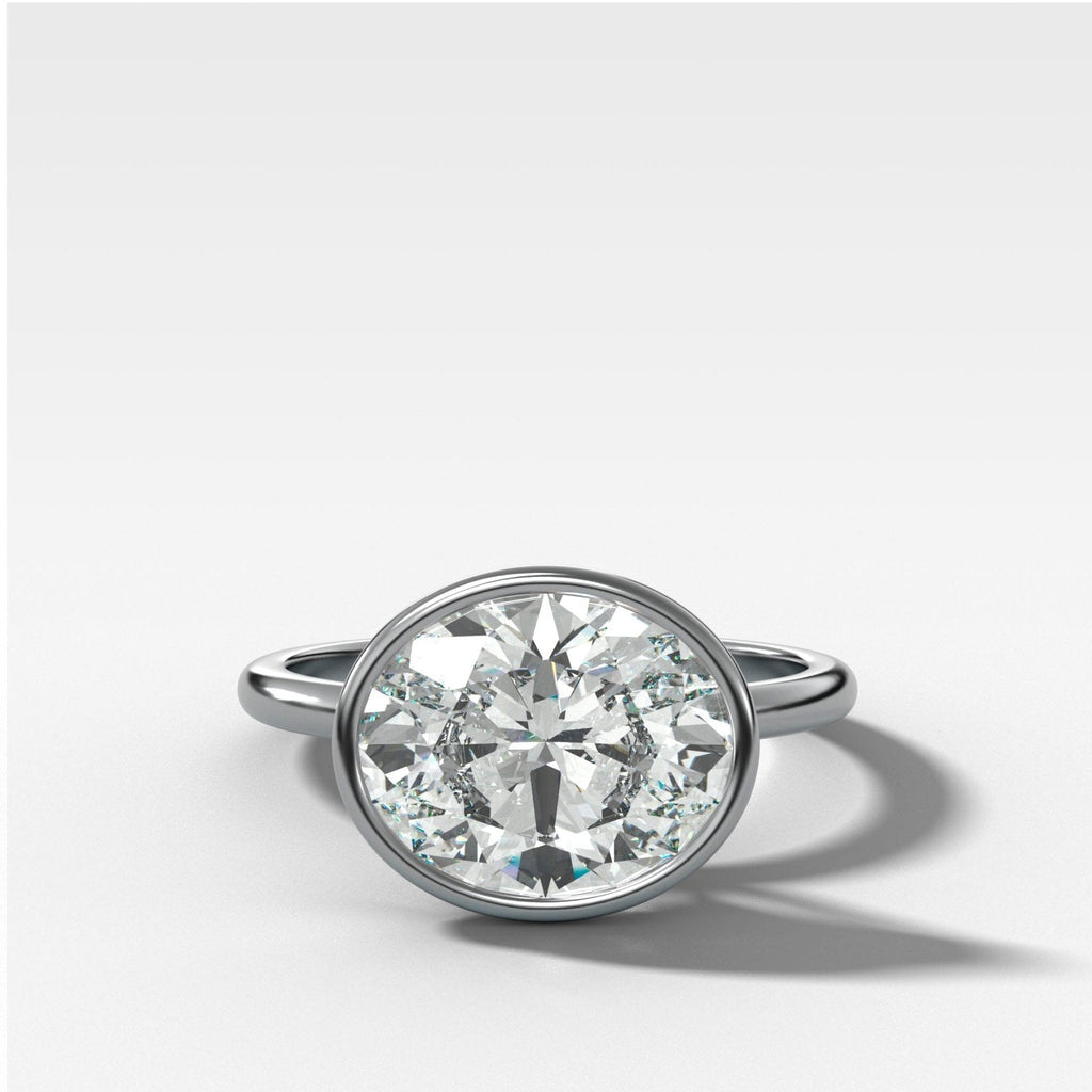 Penumbra Bezel Set Engagement Ring With East West Oval Cut