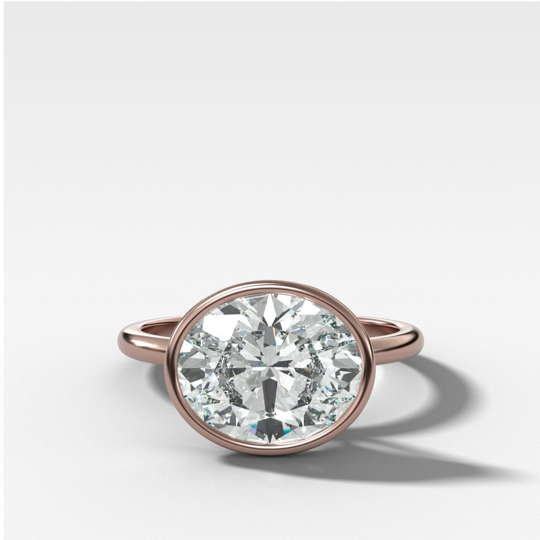 Penumbra Bezel Set Engagement Ring With East West Oval Cut