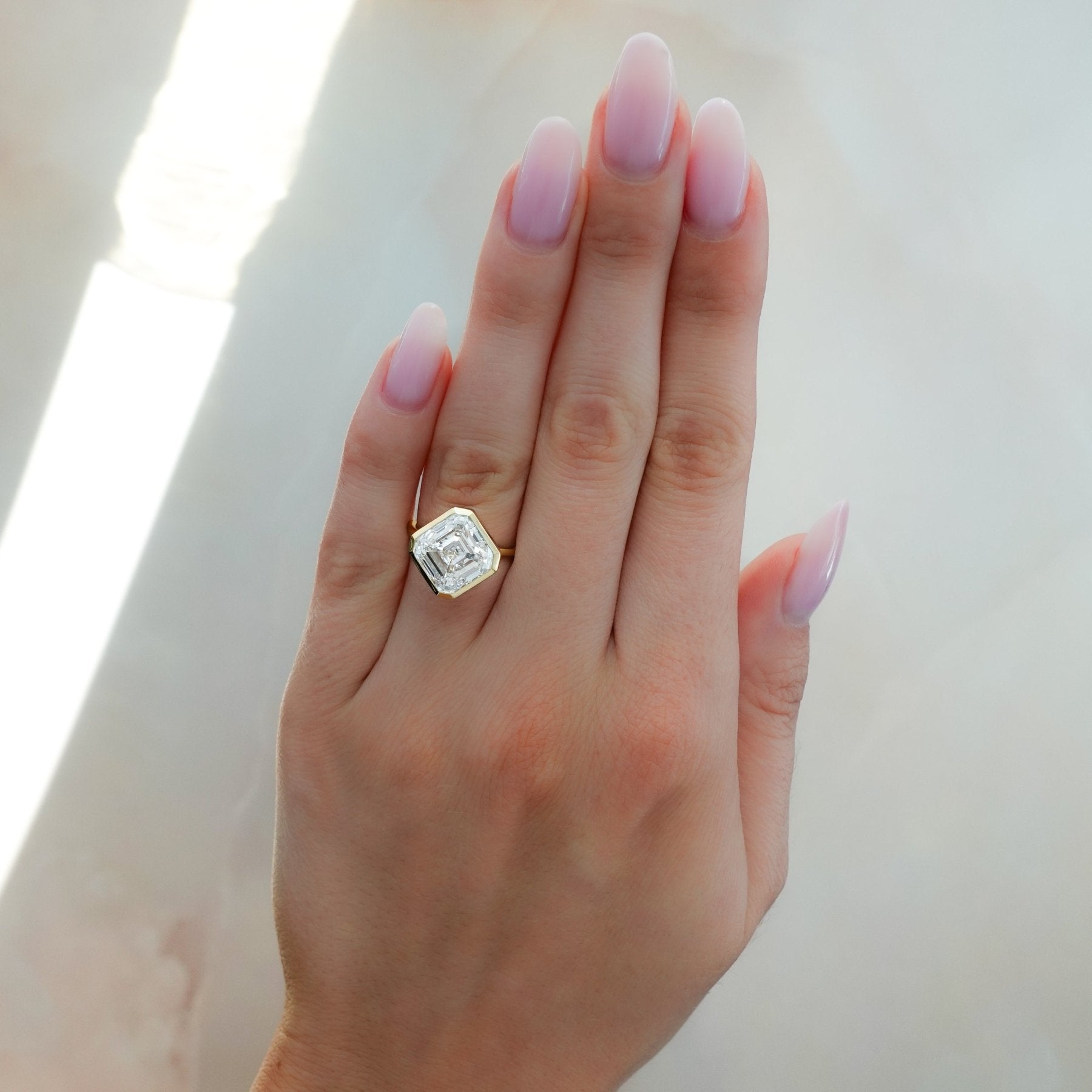 Penumbra Bezel Set Engagement Ring With Tilted Asscher Cut
