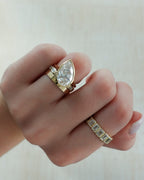 Penumbra Bezel Set Engagement Ring With Tilted Pear Cut