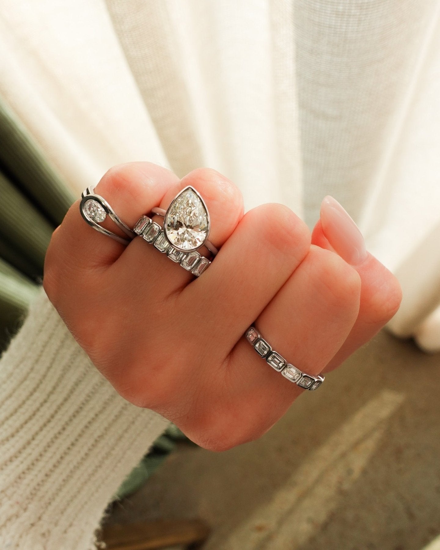 Penumbra Bezel Set Engagement Ring With Tilted Pear Cut
