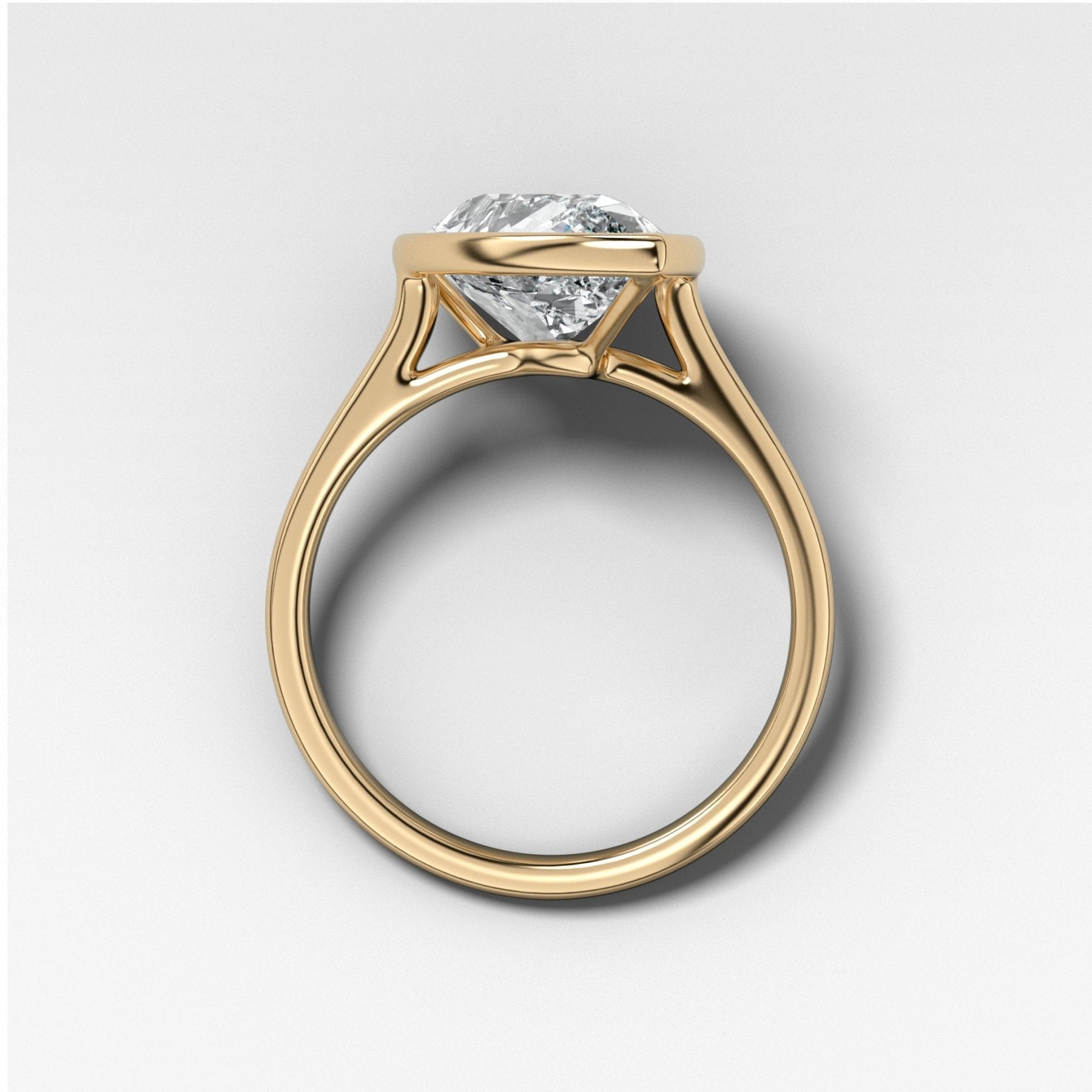 Penumbra Bezel Set Engagement Ring With Tilted Pear Cut
