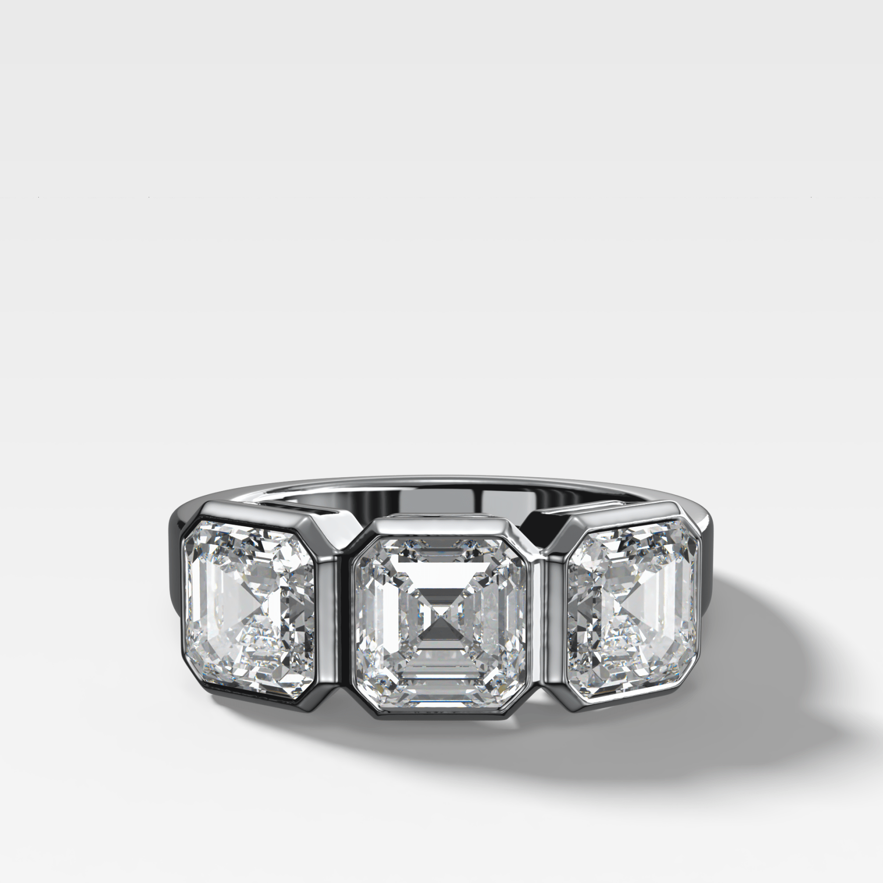 Penumbra Bezel Triad Engagement Ring With Asscher Cut Diamonds