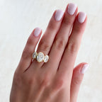 Penumbra Bezel Triad Engagement Ring With Oval Cut Diamonds