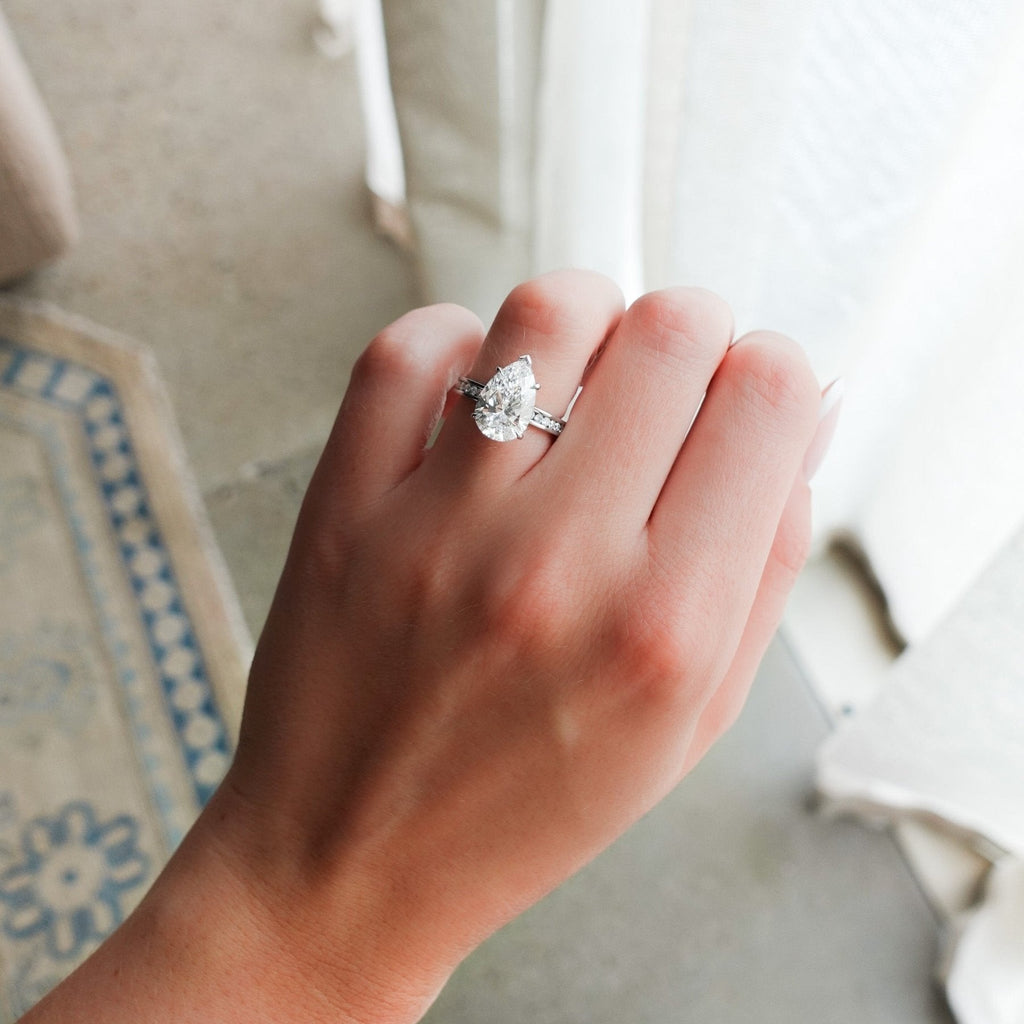 Petite Channel Set Engagement Ring with Pear Cut Diamond