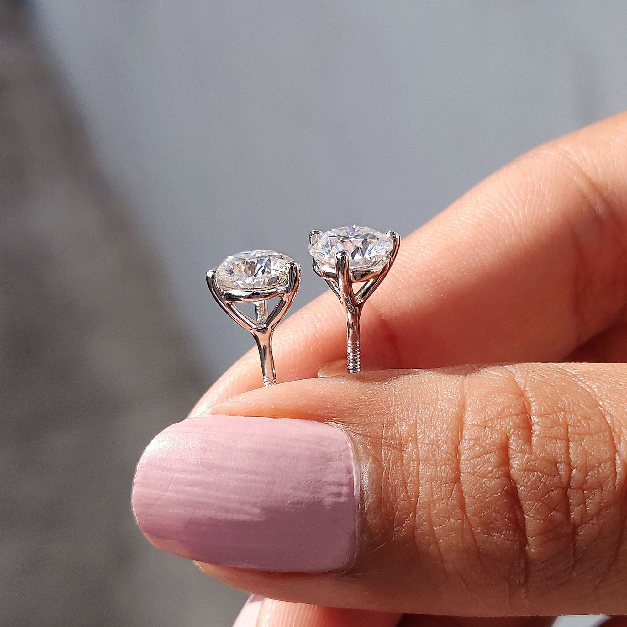 Round Cut Moissanite Earrings In Stud Style