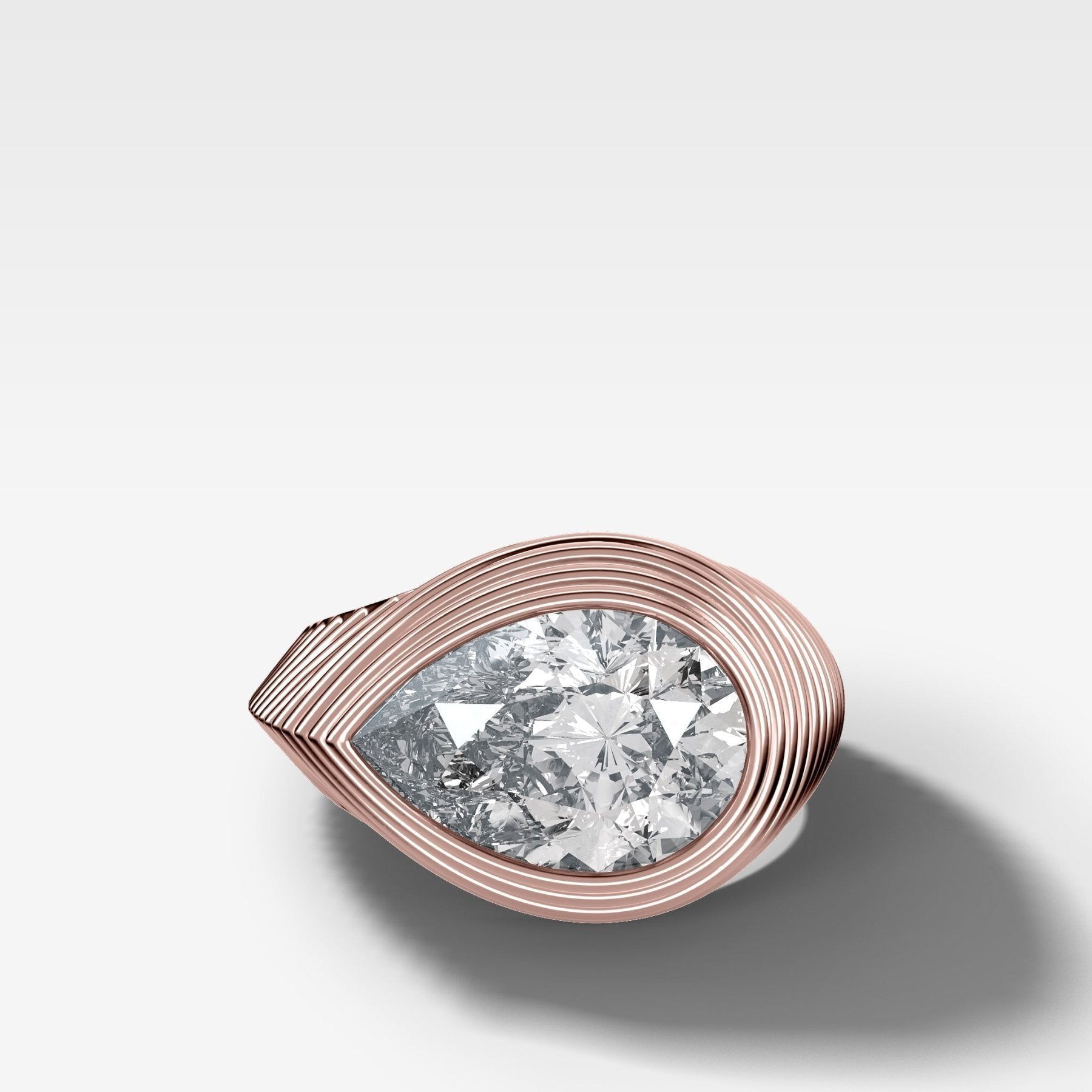 Ripple Solitaire Engagement Ring with East West Pear Cut Diamond
