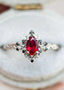 rose halo with oval lab grown ruby and black diamonds wedding ring DisneyValley