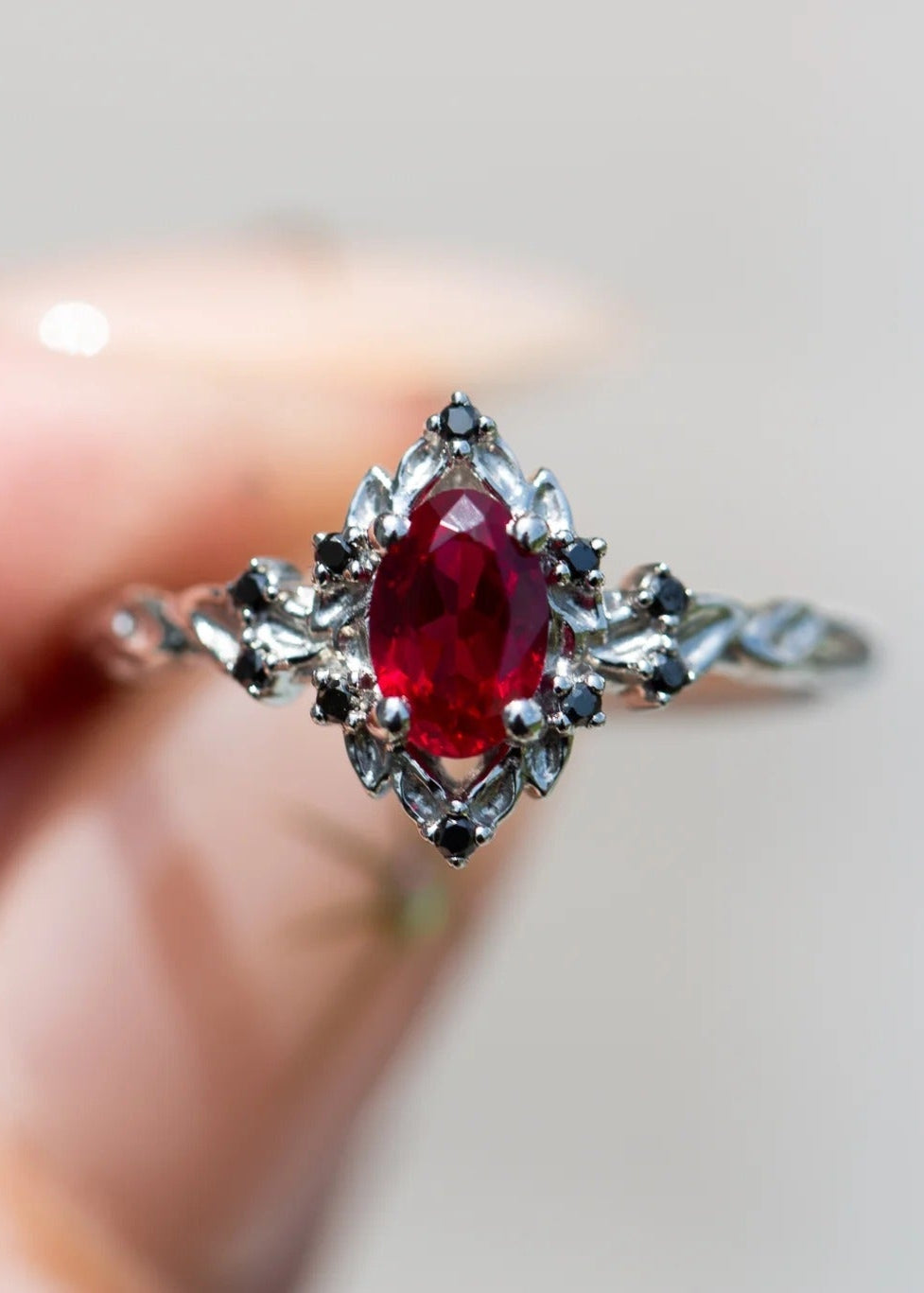 rose halo with oval lab grown ruby and black diamonds wedding ring DisneyValley
