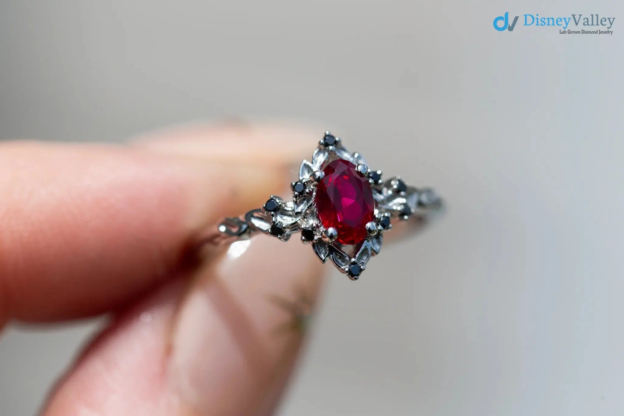 rose halo with oval lab grown ruby and black diamonds wedding ring DisneyValley