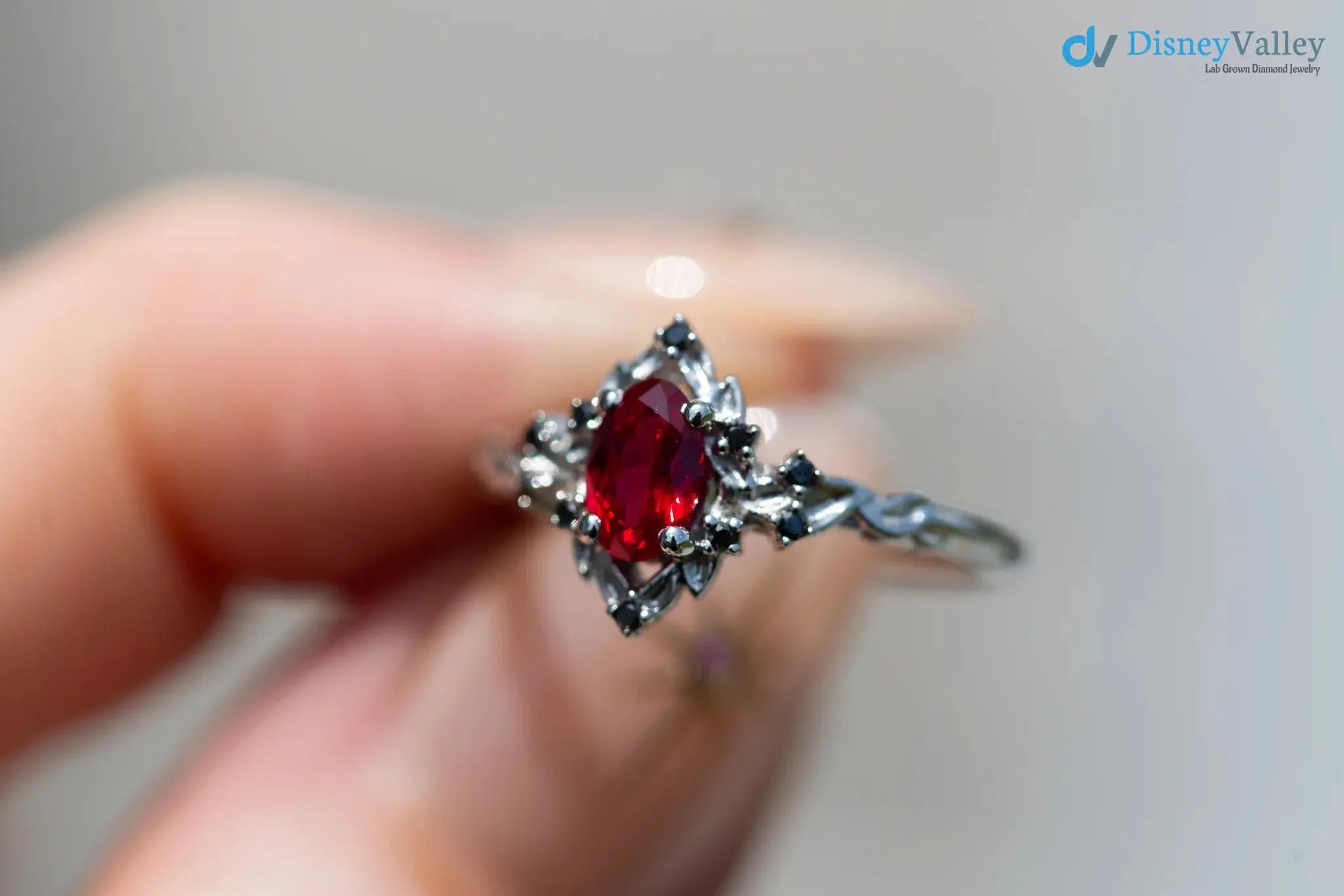 rose halo with oval lab grown ruby and black diamonds wedding ring DisneyValley