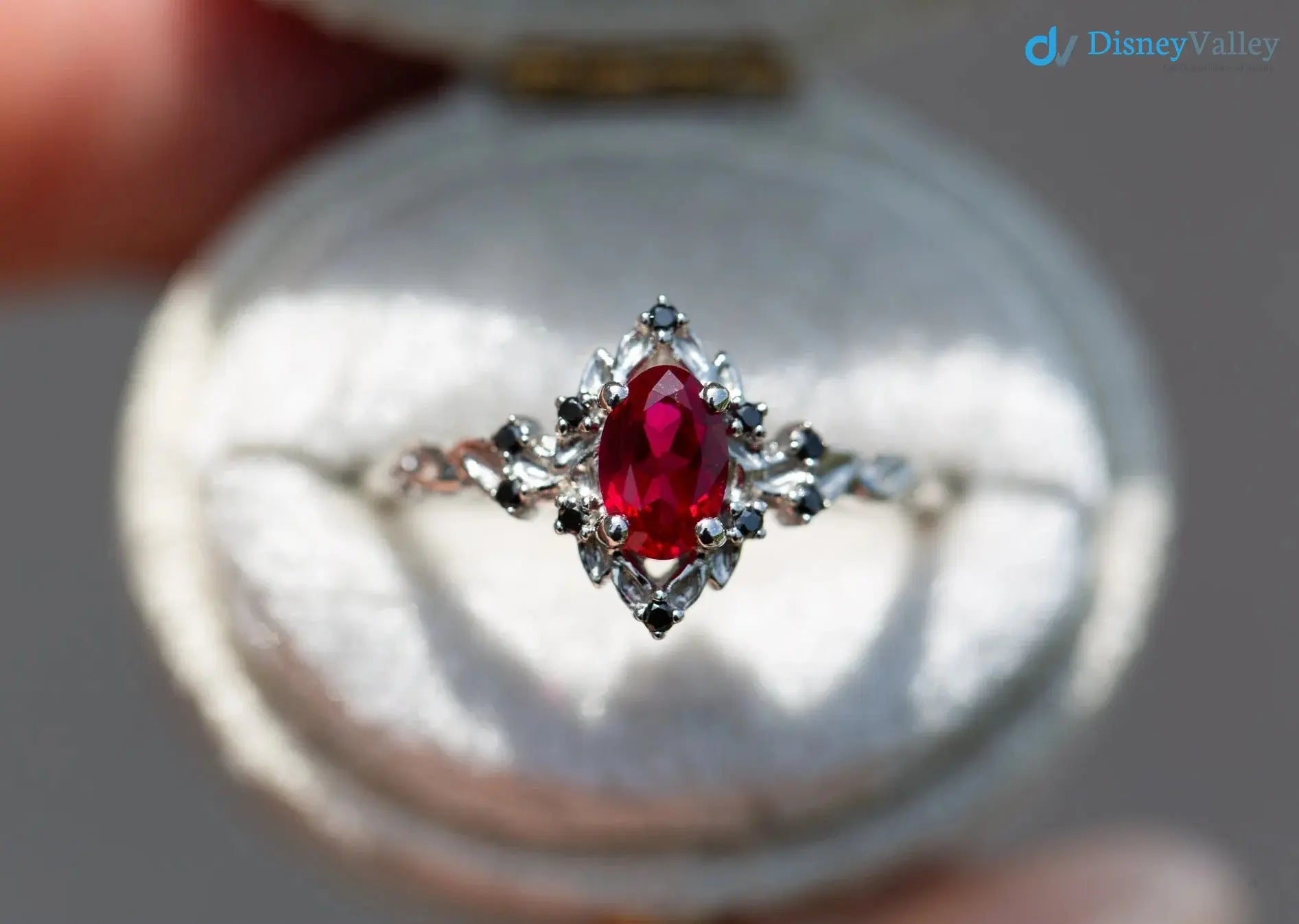 rose halo with oval lab grown ruby and black diamonds wedding ring DisneyValley