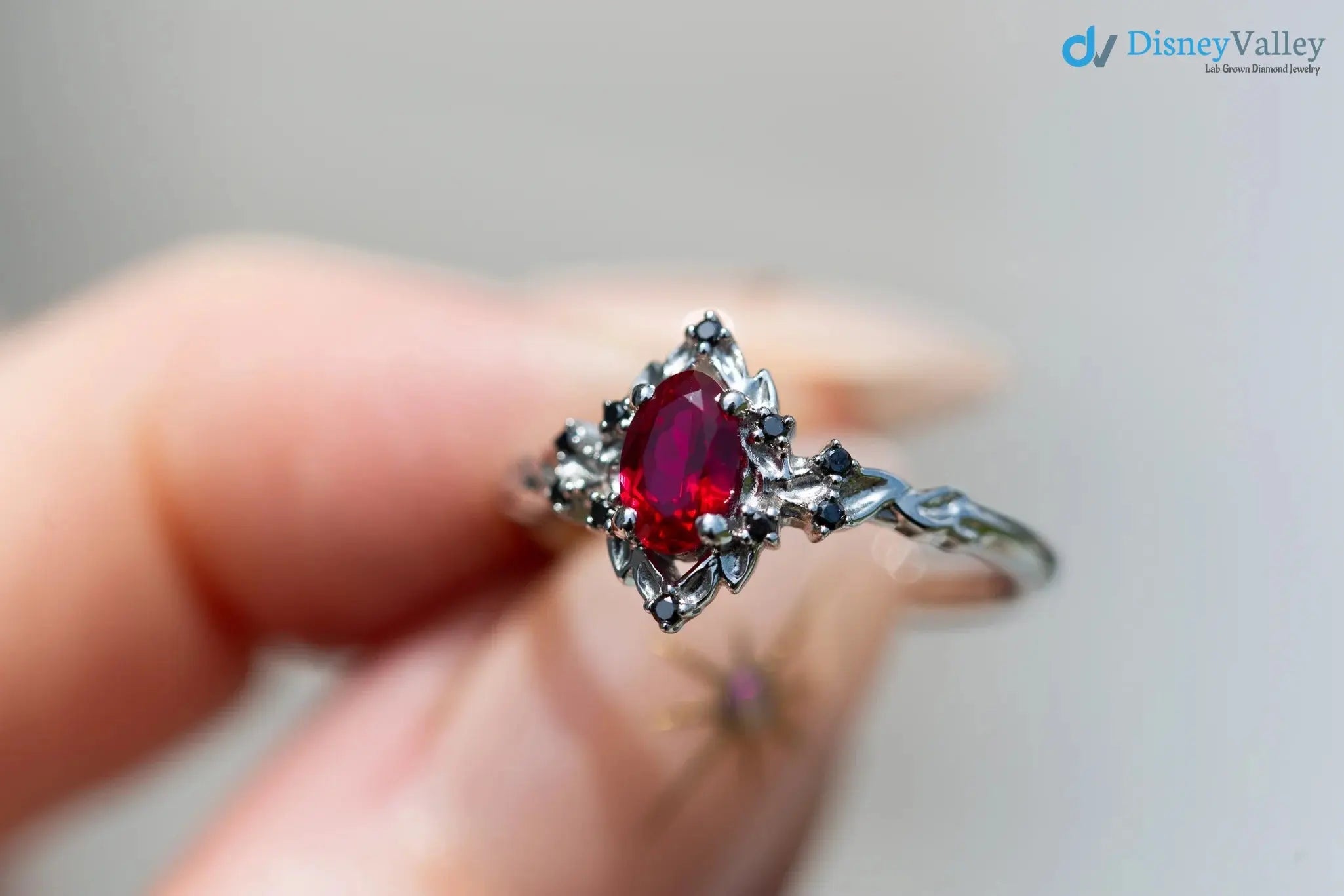 rose halo with oval lab grown ruby and black diamonds wedding ring DisneyValley
