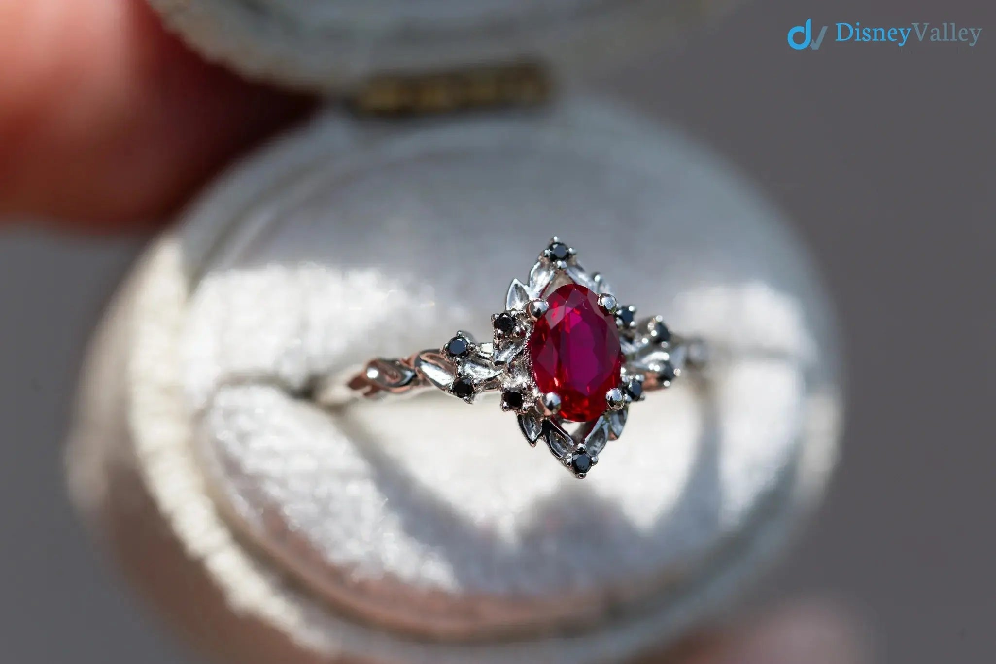 rose halo with oval lab grown ruby and black diamonds wedding ring DisneyValley