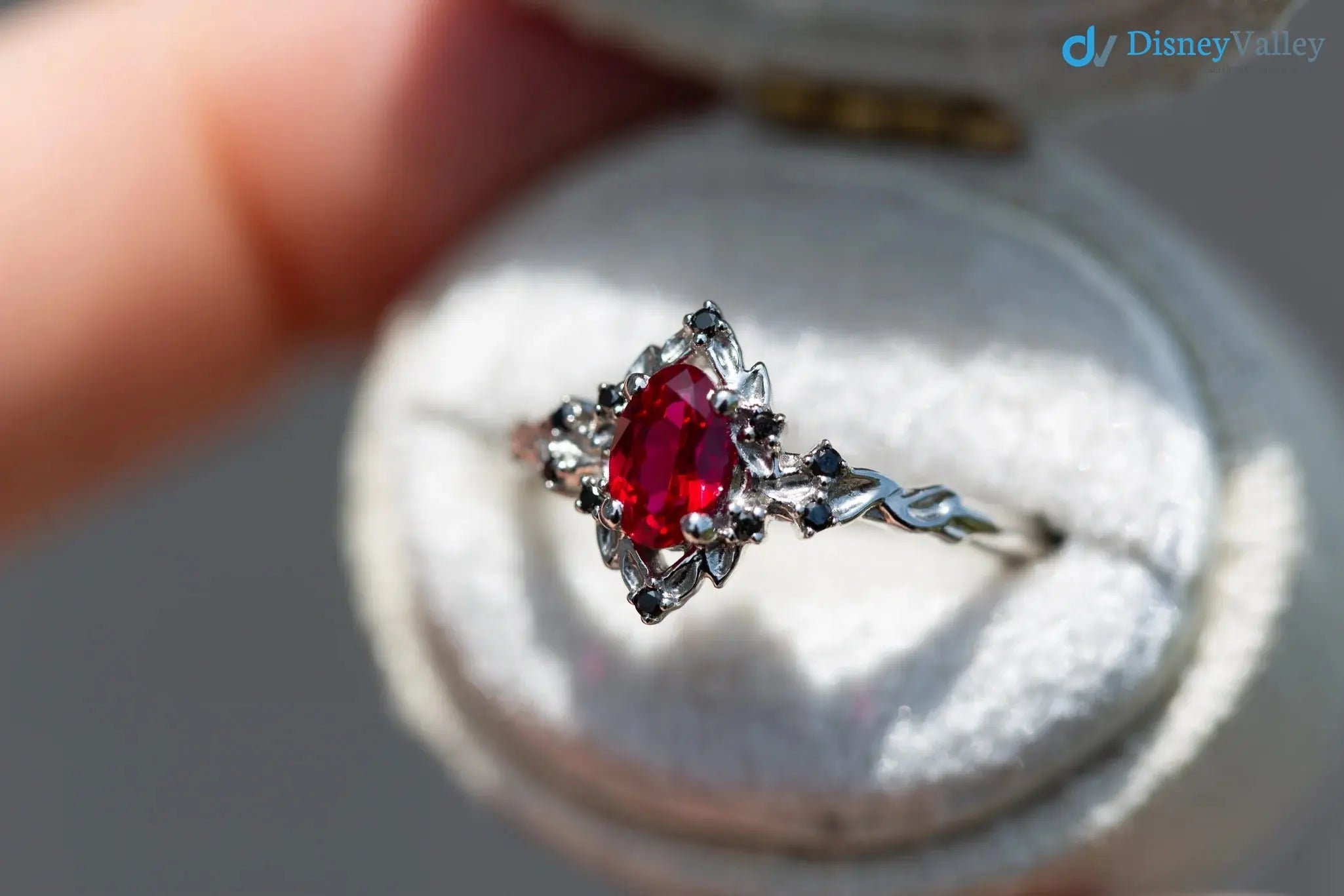 rose halo with oval lab grown ruby and black diamonds wedding ring DisneyValley
