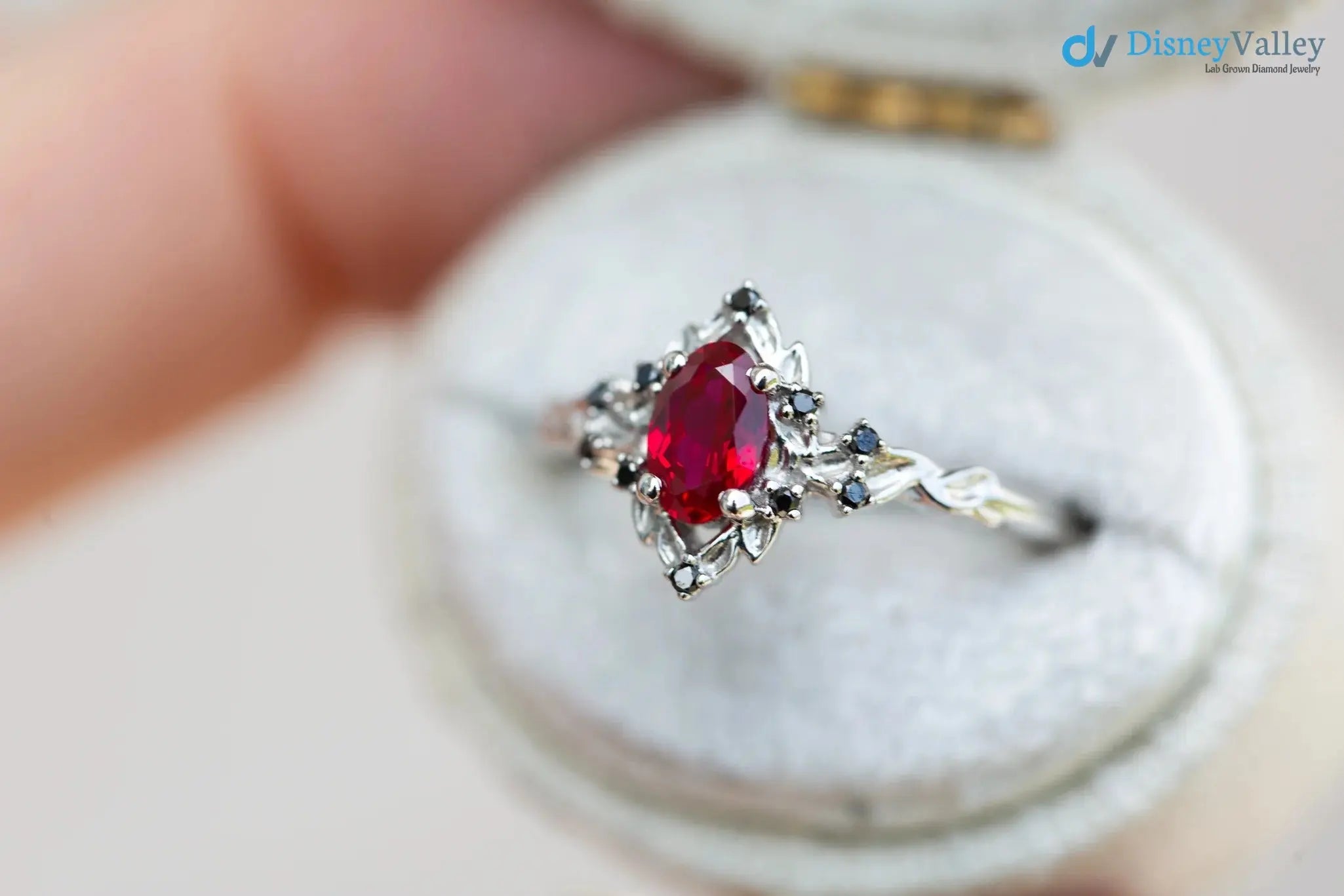 rose halo with oval lab grown ruby and black diamonds wedding ring DisneyValley