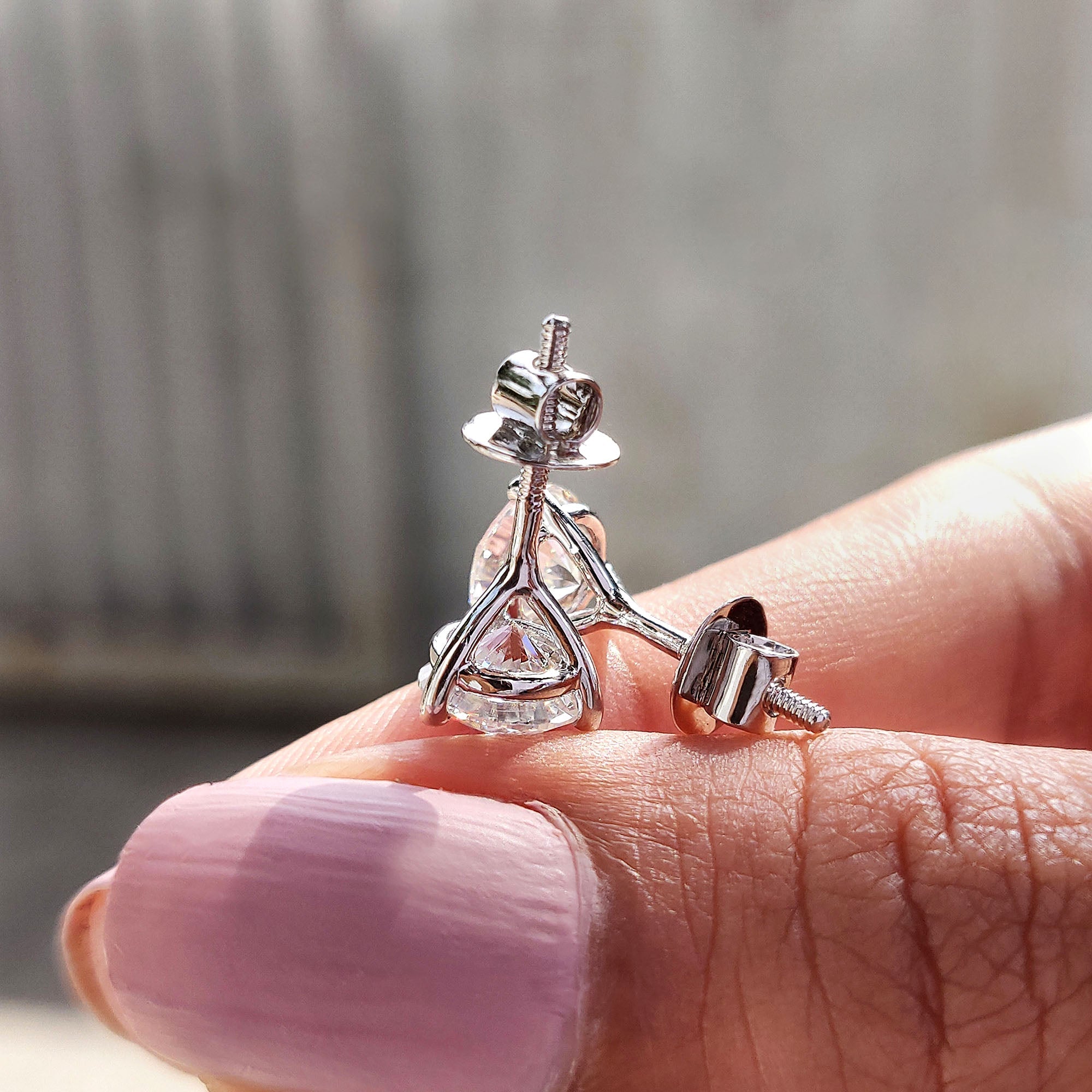 Round Cut Moissanite Earrings In Stud Style