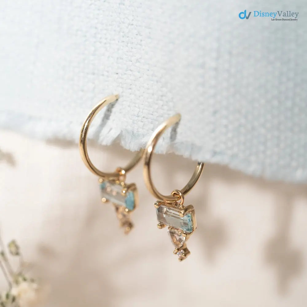 sophisticated pair of solid gold huggie hoop earrings - DisneyValley Main image