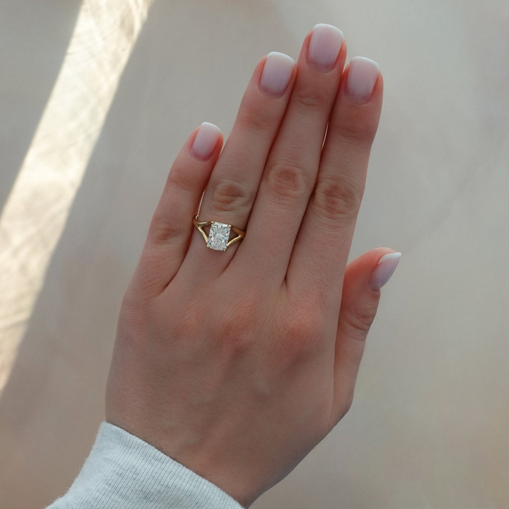 Split Shank Solitaire Engagement Ring with Elongated Radiant Cut Diamond