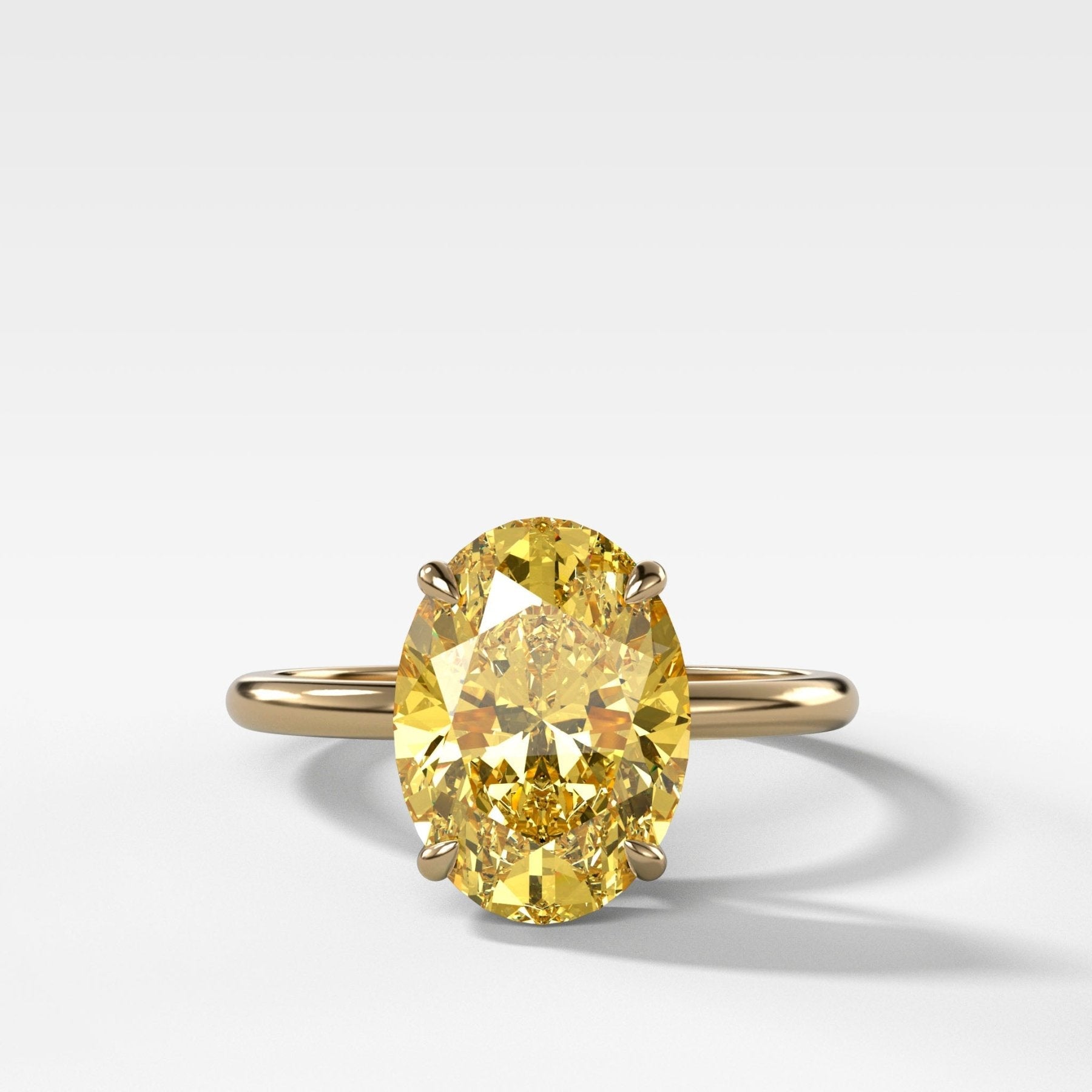 Thin + Simple Solitaire Engagement Ring With Canary Yellow Oval Cut Diamond