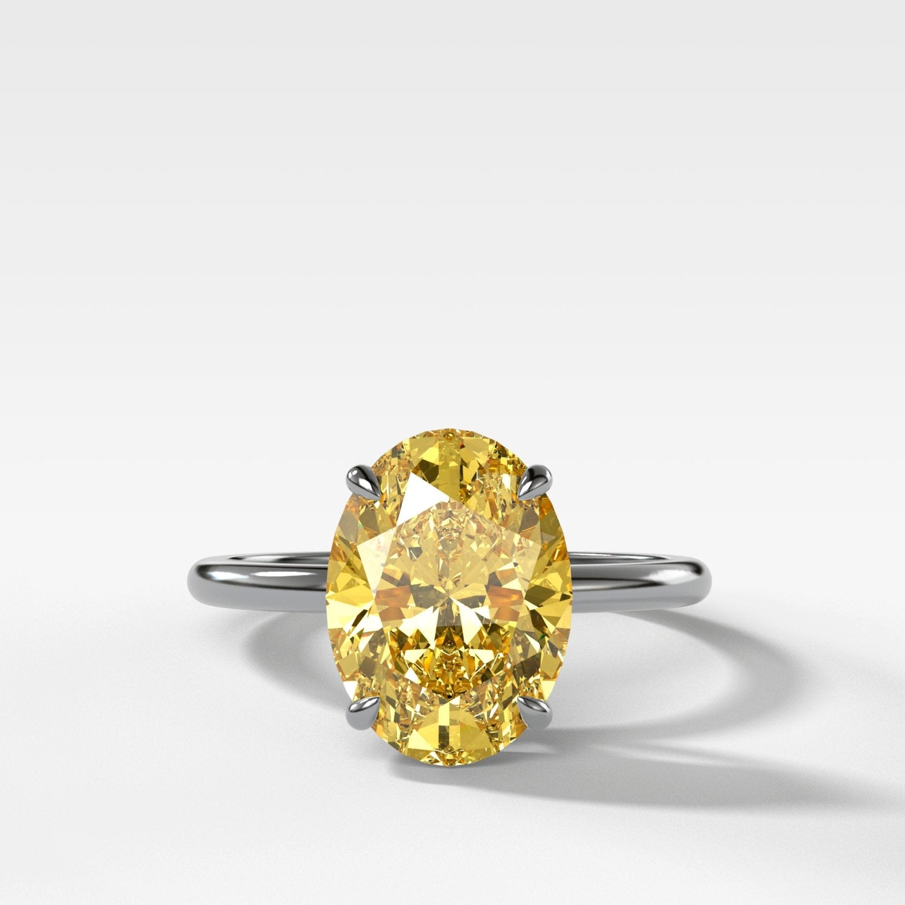 Thin + Simple Solitaire Engagement Ring With Canary Yellow Oval Cut Diamond