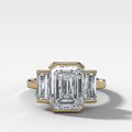 Three Stone Engagement Ring with Half Bezel Baguette Side Stones and Emerald Cut Diamond