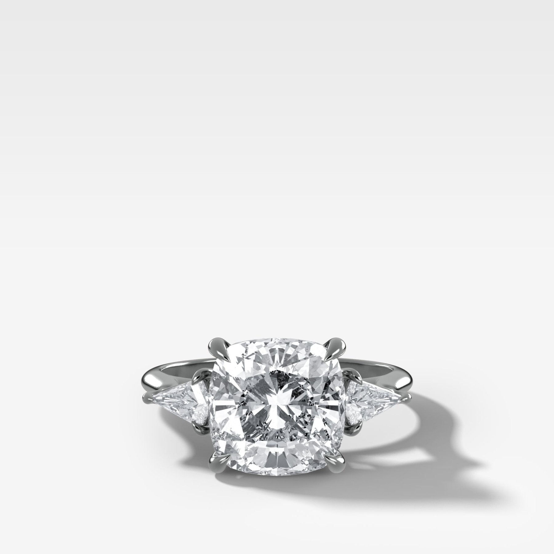 Three Stone Engagement Ring With Kite Side Stones and Cushion Cut Diamond