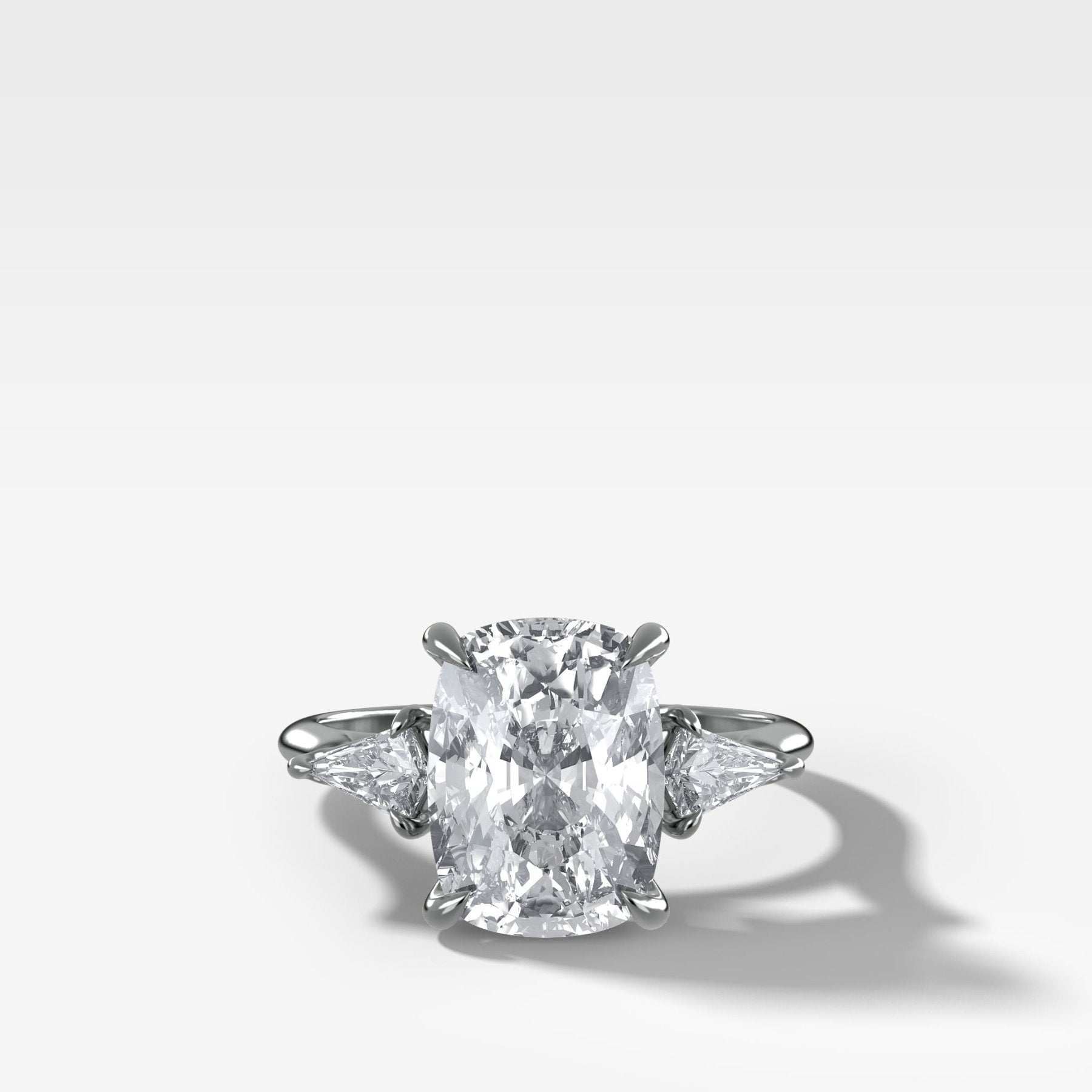 Three Stone Engagement Ring With Kite Side Stones and Elongated Cushion Cut Diamond