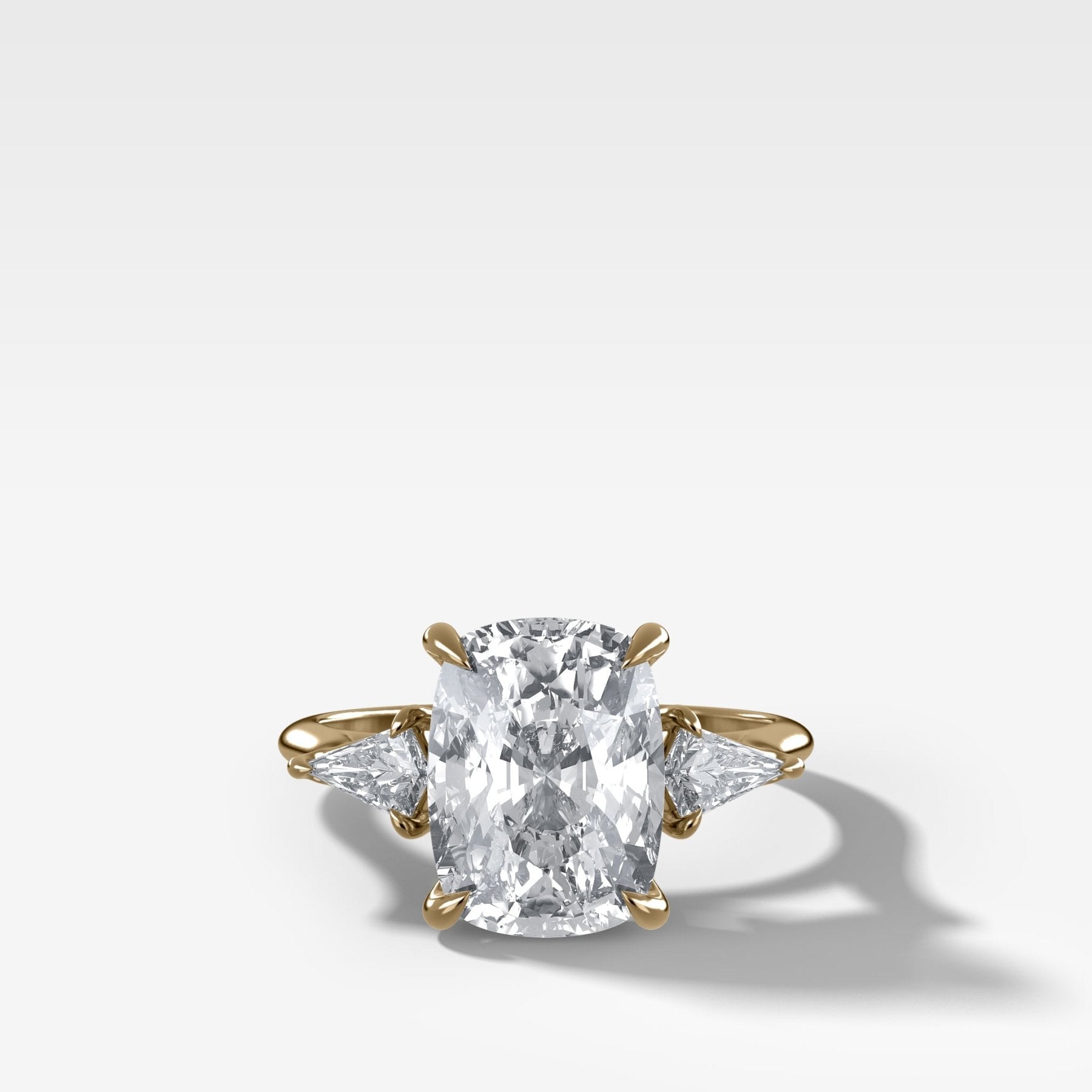 Three Stone Engagement Ring With Kite Side Stones and Elongated Cushion Cut Diamond