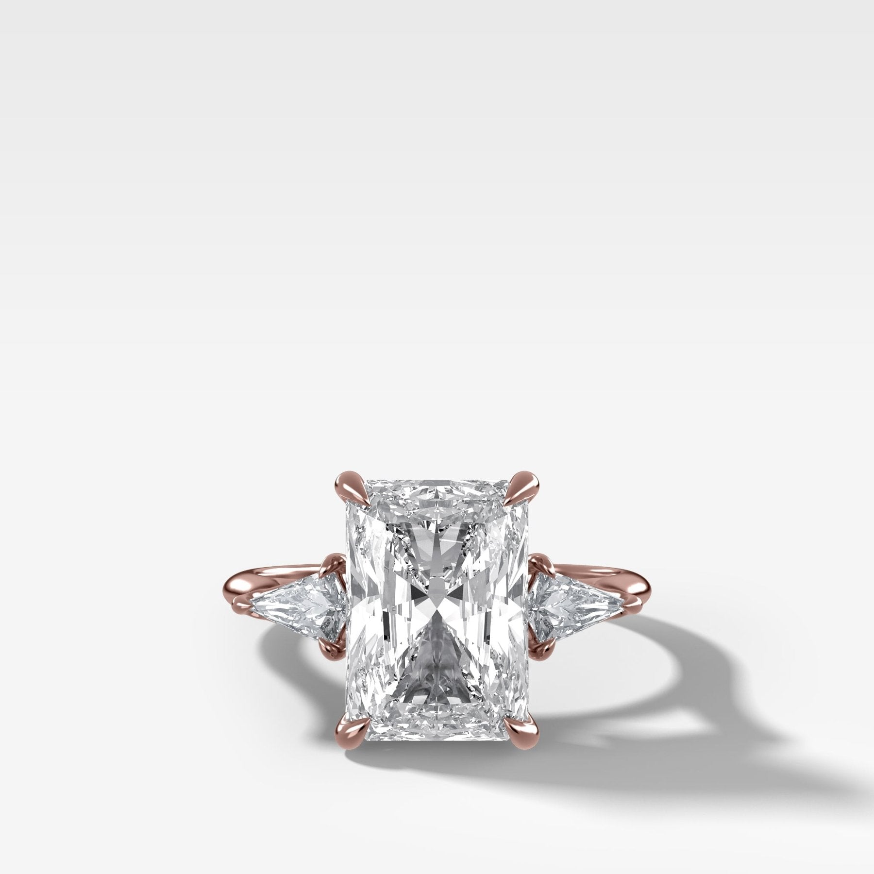 Three Stone Engagement Ring With Kite Side Stones and Elongated Radiant Cut Diamond